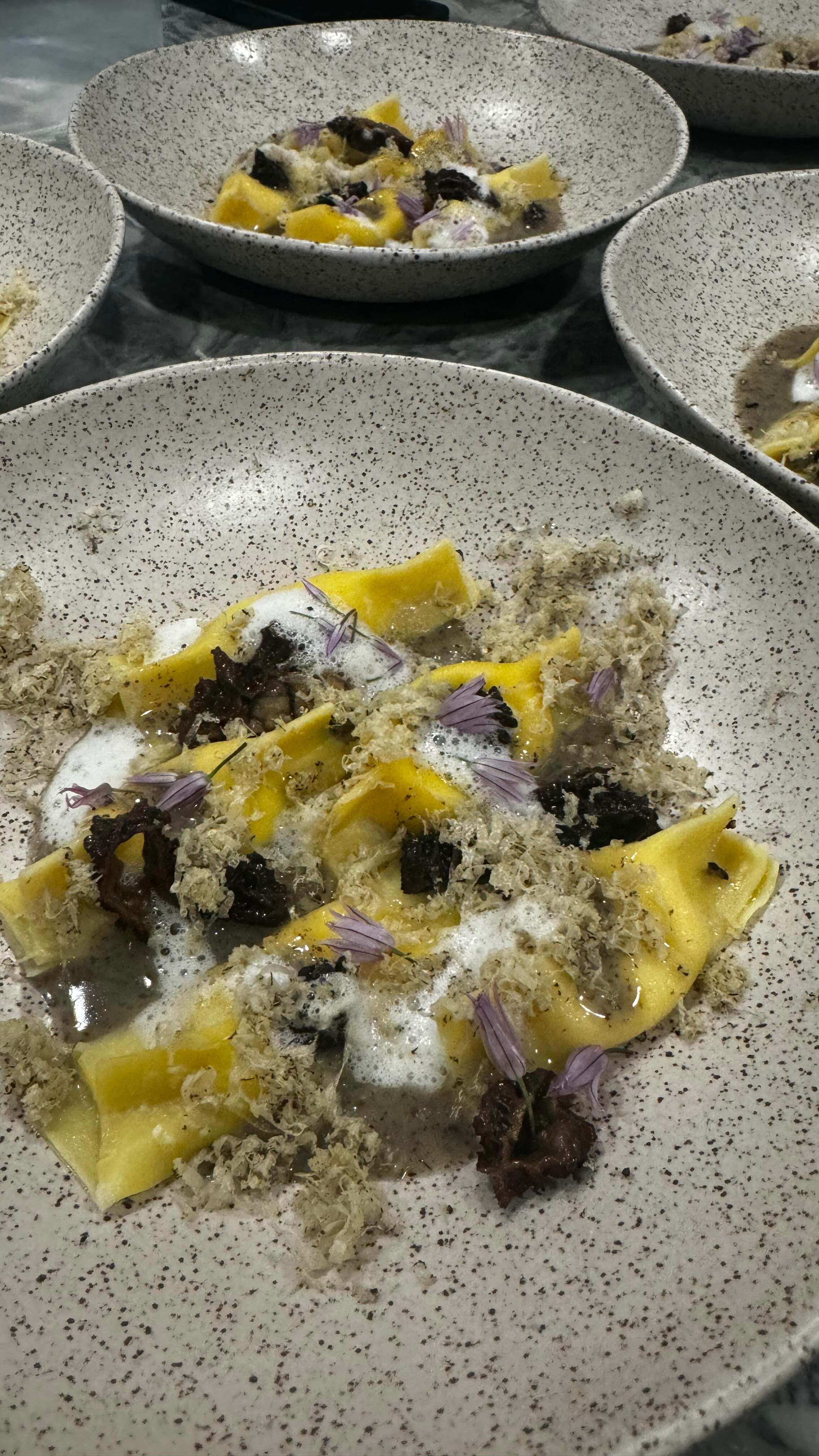 Morel mushroom season aligns perfectly with Périgord truffle season in the Southern Hemisphere, particularly in regions like Australia and Chile. These are the same prized truffles harvested in Spain and France during the fall.
We bring them together in this pasta course, using the Scarpinocc shape—chosen for its little “belly button” that cradles the truffle butter beautifully. The pasta is filled with our house-made ricotta and finished with a delicate foam made from the whey. It’s garnished with chive blossoms and a generous shaving of fresh Périgord truffle.
At its heart, it’s a simple celebration of mushrooms, onions, and cheese.
#privatechef #grandrapids #eater #jamesbeardfoundation #privatedining #finedinning #phoneeatsfirst • #PrivateChefExperience #HomeFineDining #ChefTastingMenu
#SeasonalIngredients
#SmallEventCatering
#ModernPlating
#FoodiesOfInstagram
#EatLocalGrandRapids
#GrandRapidsFoodie #SeasonalCuisine
#FarmToTable
#TruffleLover
#FoodIsArt
#DinnerPartyGoals
#TinyDinners
#MichiganPrivateChef
#WestMichiganEvents