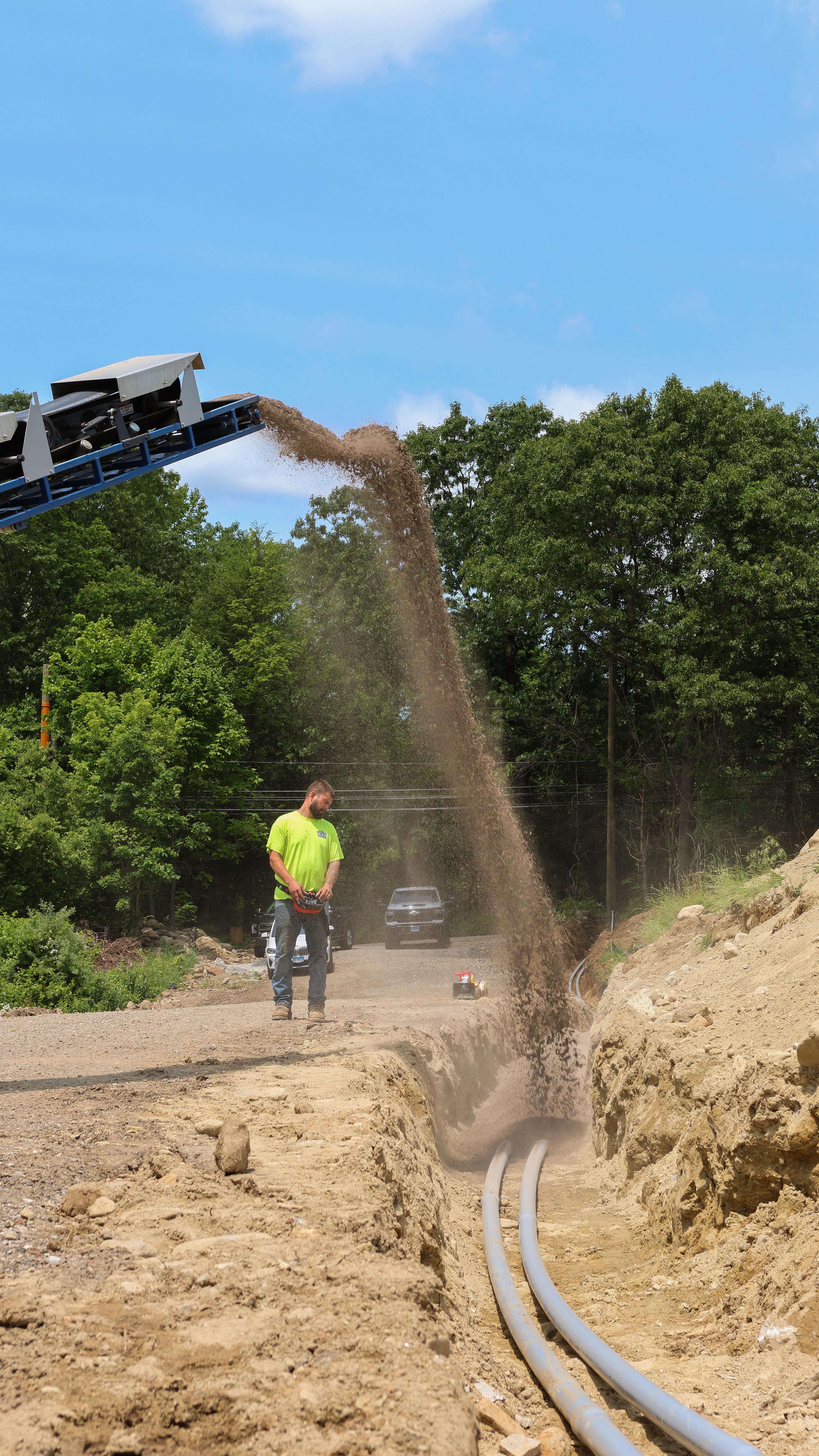 The Load Launcher performed backfilling of a 4 foot wide electrical trench recently over in Seymour Connecticut. We were able to cover the conduit with pipe bedding at a rate of 33 feet per minute. The trench was a total of 280 feet and we completed the job in 15 minutes using 22.5 tons.
.
.
.
#LoadLauncher #StoneSpreader #StoneSlinger #Aggregates #StoneSupply #SiteWork #HeavyEquipment #ConstructionInnovation #MaterialDelivery #QuarryLife #Backfilling #PipeBedding #ElectricalTrench #CrushedStone #Triaxle #CanAmerican #DeFeoMaterials