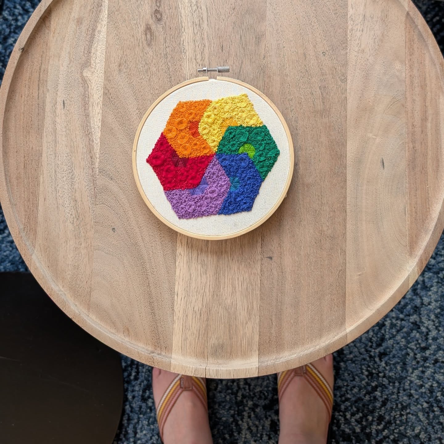 Finished. My niece took the last stitch in Omaha, Nebraska. I love this fun thing I've started - to have whomever I'm with take the final stitch of each piece.💙💙 #imperfectlybeautifulstitches #myneedletoday #frenchknotsfordays #rainbowpinwheel #mytryptich #myneedleandthread @addielichte