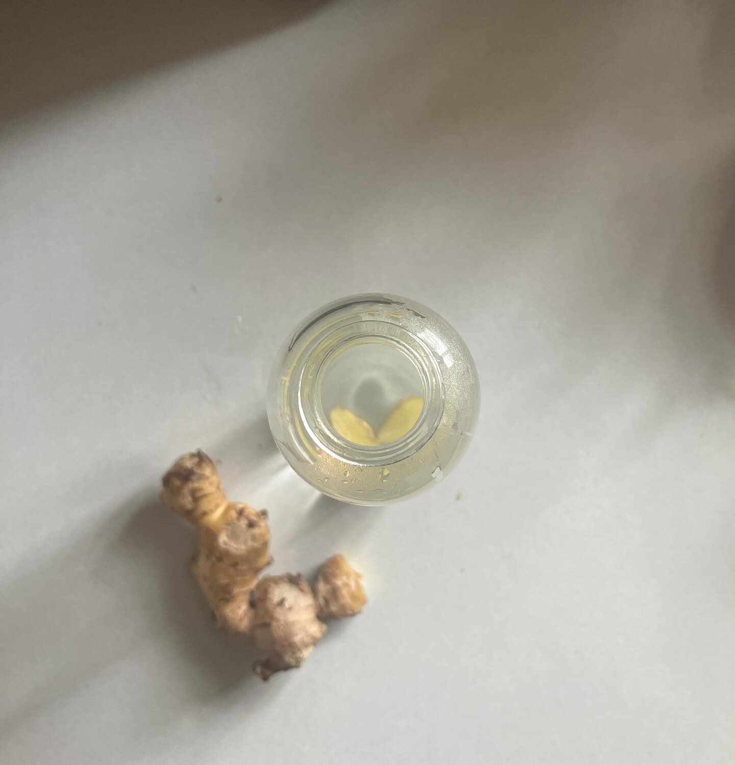 My drink bottle looks a little different in winter 🥶
I’m adding a couple of slices of raw ginger in the morning, filling half with hot water and half with room temperature water. Then just topping up throughout the day as needed. This obviously works well in a glass bottle but could work in a big thermos mug too.
As ginger is a circulatory stimulant it’s helping to keep cold fingers and toes a little warmer while gently stimulating the digestive system.
Ginger is one food we always try to buy organic, it’s quite heavily pesticided in Australia and because I’m a little lazy with peeling - it feels like the safest option. If you can only source non-organic ginger I would say peeling is more of a priority (to reduce pesticide residue). 🧡