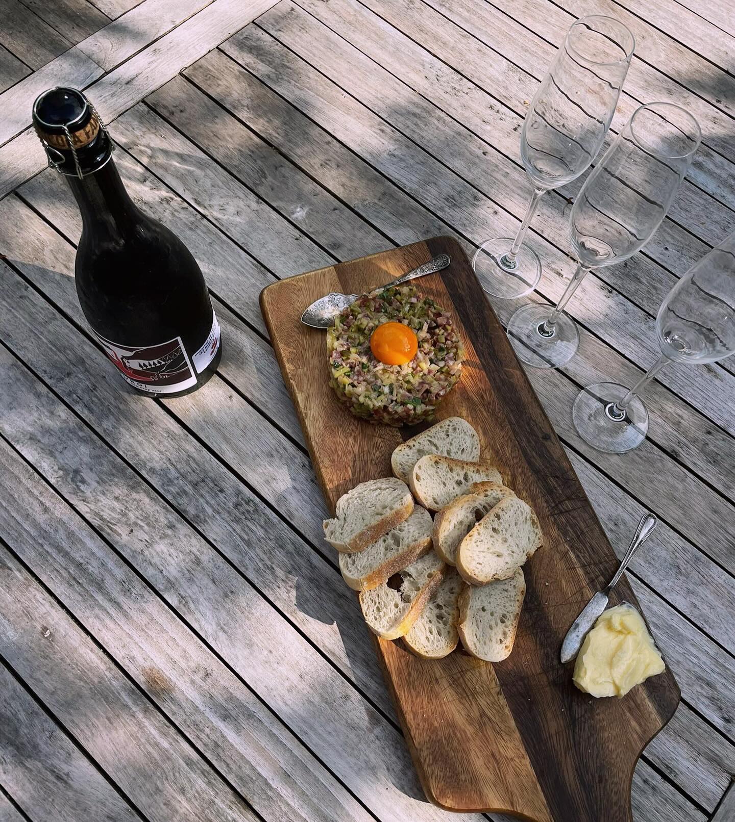 Taste test with the team (we don’t mind really) - our saucisson tartare with a yolky cacklebean egg & a sparkling red. The perfect sharing meal for a sunny day! Opening soon!! #cafe #wine #tartare #cotswoldscafe