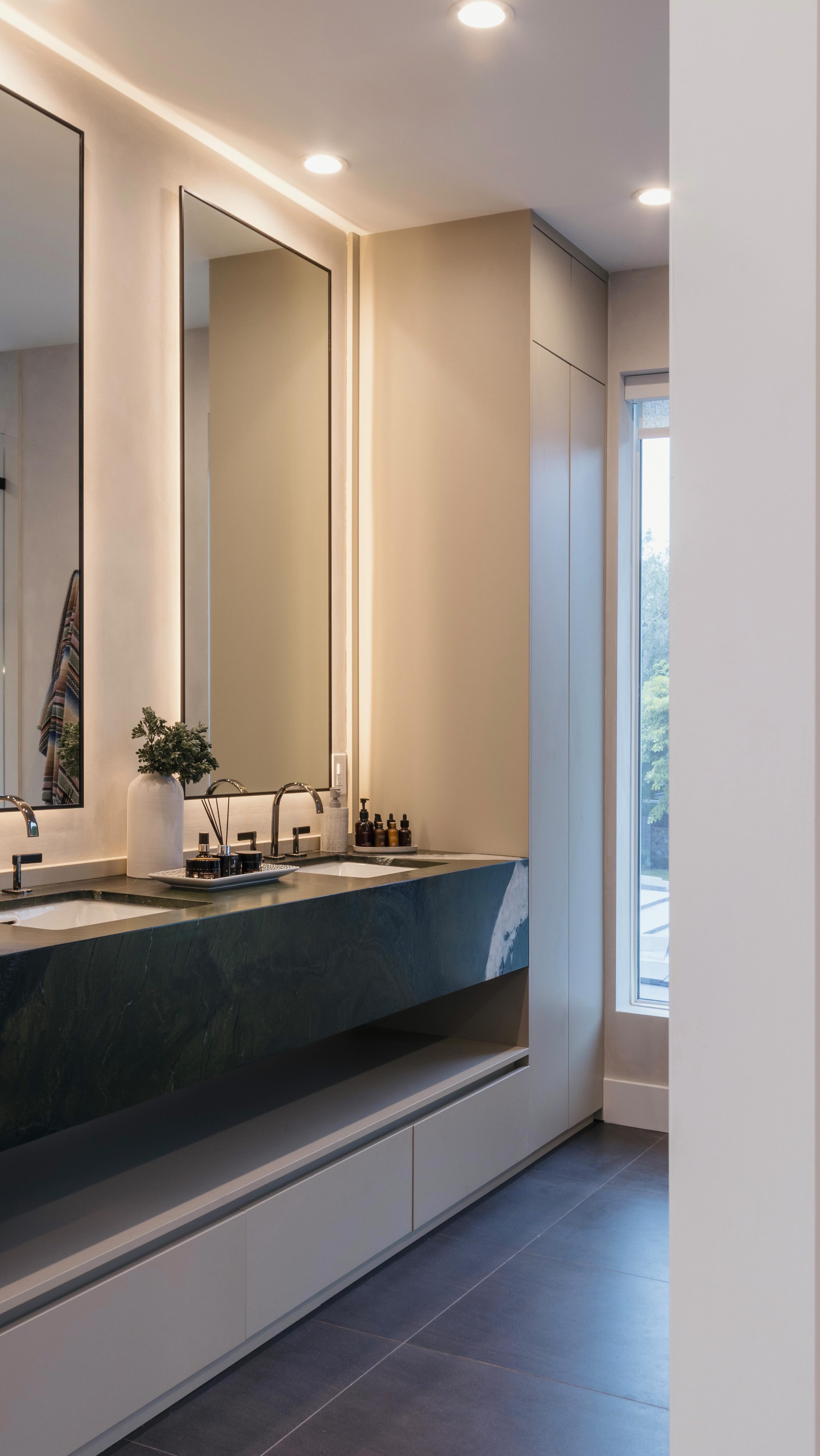 This bathroom is all about balance — soft, minimal millwork sets the tone, letting the leathered green 🥑 stone take the spotlight. It adds the perfect depth and texture to keep things interesting.. #BoltLiving
#bathroomdesign #interiordesign #designbuild
.
.
.
.
.
.
.
.
#greenmarble #modernbathroom #homedesign #homerenovation #interiordesigner #modernhome #miamiinteriordesign #interiorstyling #homestyle