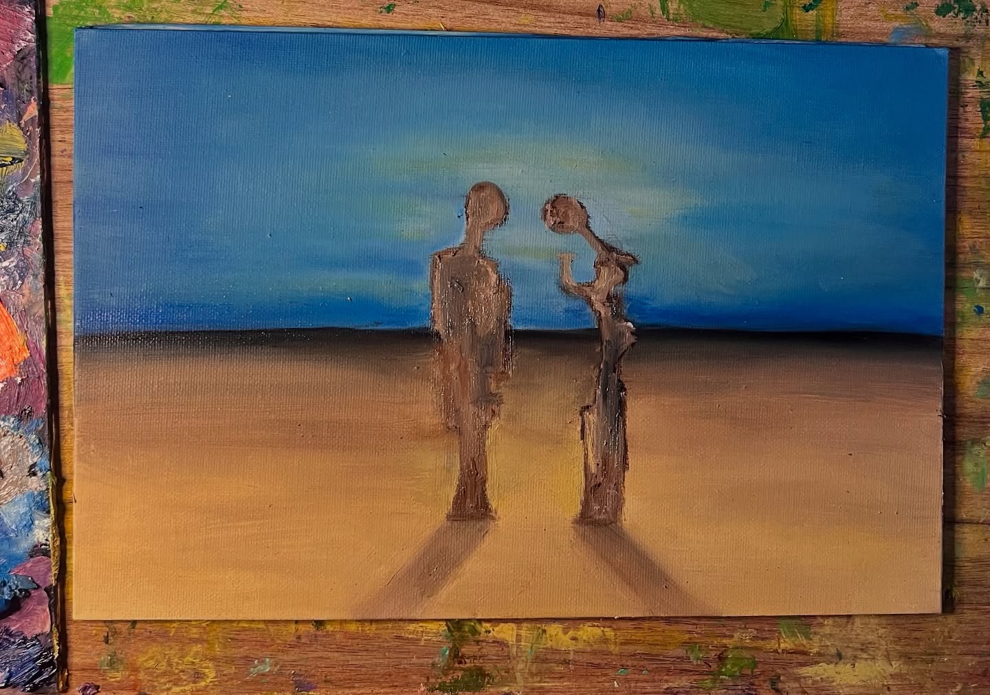 Title: Dalí’s Angel
(work in progress)
I’ve never been interested in recreating anyone else’s work. That’s never been the point of painting for me. But just as Dalí became obsessed with Millet’s The Angelus, I’ve found myself, for the past 20 years, obsessed with Dalí’s own haunting reinterpretation of it.
This painting isn’t a copy or a tribute, it’s more like something was conjured. Like a spirit of Dalí himself stirred something in me, and I suddenly had to paint. I don’t claim this piece is my best by any stretch, but I’ve never been more precious or more dedicated to a single painting. It’s very much a work in progress, most of it emerged in a single sitting, with a second session refining it slightly. But the process has already taught me so much.
My painting style isn’t neat or tidy, and this piece has asked me for patience in a way others haven’t. It’s also made me reflect again on why I love Dalí’s work so deeply. His reinterpretation of The Angelus is so melancholic, so dreamlike. The figures, or statues seem at once majestic and crumbling. Beautiful, frightening, and deeply mysterious.
As with my paintings, my thoughts are still in progress. But I hope to finish this piece soon, and to share a more complete update.