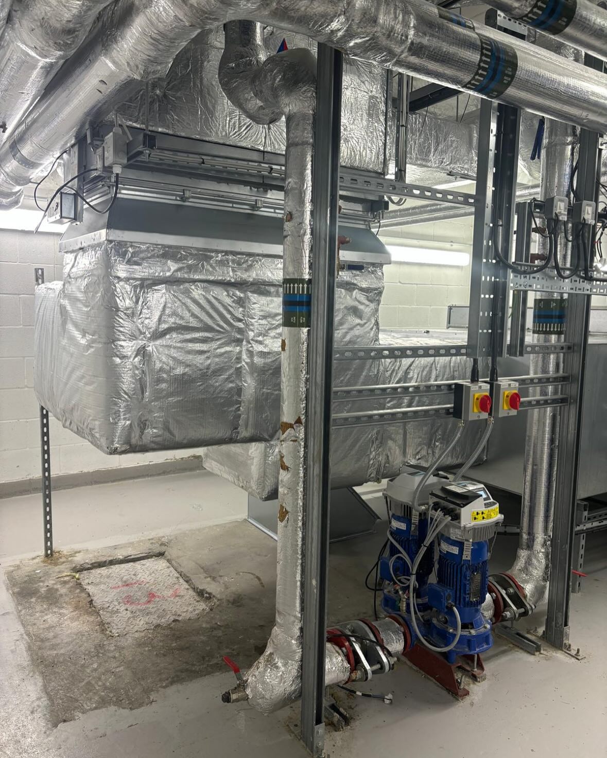 Ductwork adapted in this high-end hotel to allow access to this manhole. The manhole had been concreted over by the developers and completely hidden by the supply air ductwork. It is now fully accessible for drainage maintenance & repairs