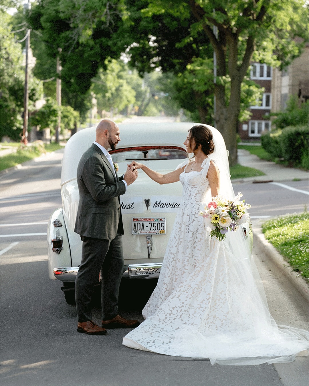 This is your sign to hire a chauffeur with a vintage car for your wedding day! Tara + Mark rode in style around Madison in a 1939 Cadillac on their wedding day. They left their ceremony and reception with a confetti exit and a sparkler exit and hopped right in this amazing car. The driver even added the “JUST MARRIED” sign on the back as a surprise for the couple. How cute is that?? What a fairytale!!
If you want to hire this exact car for your wedding day, reach out!! I know a guy 😉
Flowers by the amazing @daffodilparker
Hair and makeup by @hairbynarda
Vintage Car rental with chauffeur for Madison Wisconsin wedding. Antique car for wedding. Stylish Wedding transportation. Vintage limousine. Madison Wisconsin Wedding Photographer. Cottage core wedding. Whimsical Wisconsin wedding.