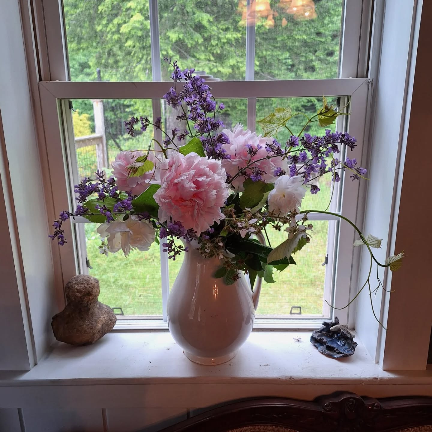 I didn't get to the peonies early enough, and still deciding if the blackberry branches were worth the blood loss -- but it's sure cheering up a rainy day.