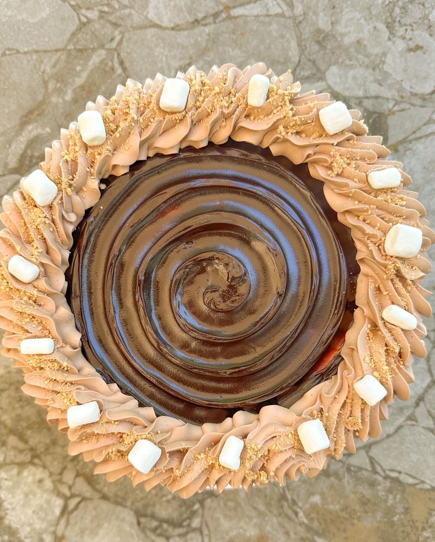 Graham cracker. Chocolate. Marshmallow. Summertime staple - S’mores on s’mores on s’mores. Give me some more s’mores! This is my summer special cake and whoooo boy is this delicious! It’s three layers of tender graham cracker cake filled with an absolutely luscious chocolate mock meringue buttercream (MMBC) and a toasted marshmallow filling, frosted in chocolate MMBC, dark chocolate drizzle, chocolate fudge swirl topping, and graham cracker crumbs. Does anything say SUMMER more than too many s’mores?! This cake is super rich and delicious and screams summer nights with every bite. Available now!
•
•
•
•
•
#Smores #Summer #Chocolate #Marshmallow #Baker #HomeBaker #HomeBakery #Homemade #Davis #VisitDavis #VisitYolo #SmallBusiness #ShopSmall #SupportLocal #WomanOwned #WomanOwnedSmallBusiness #Solopreneur #Mompreneur #SoMuchYum #BakingAndPolitics