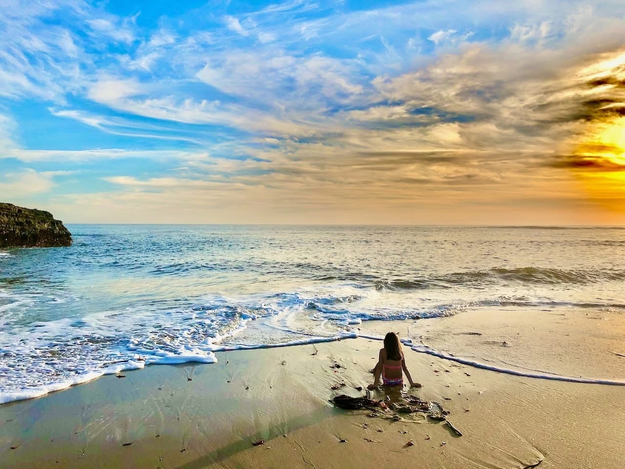 While this may seem like a postcard picture of a beach somewhere in a faraway getaway, this is a picture of my little Ava in Santa Cruz. Right in our own back yard.
