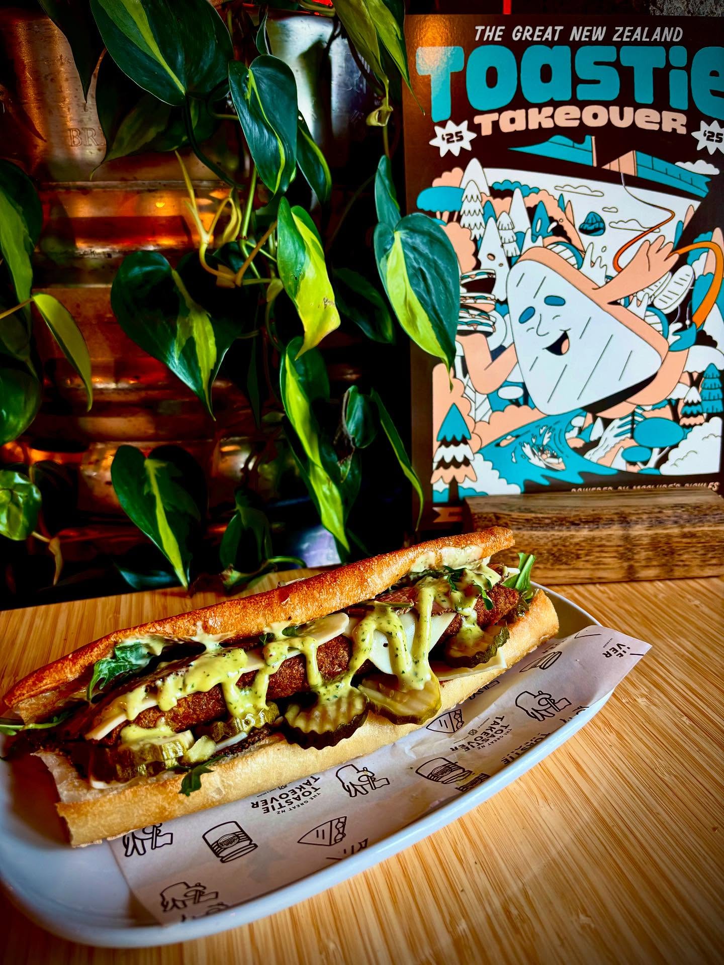 Toastie Takeover is back!!
We were central Wellington’s only finalists with our debut entry last year and boy have we outdone ourselves again this year. You all should definitely pop down and try it out.
The Fungi Chicken
A chicken parcel filled with truffle mushroom, creamy blue cheese sauce, rocket, pastrami, Swiss cheese, basil mayo and McClures sweet and spicy pickles. All encased in an ACME oli roll
@mcclurespickles
@cookandnelson