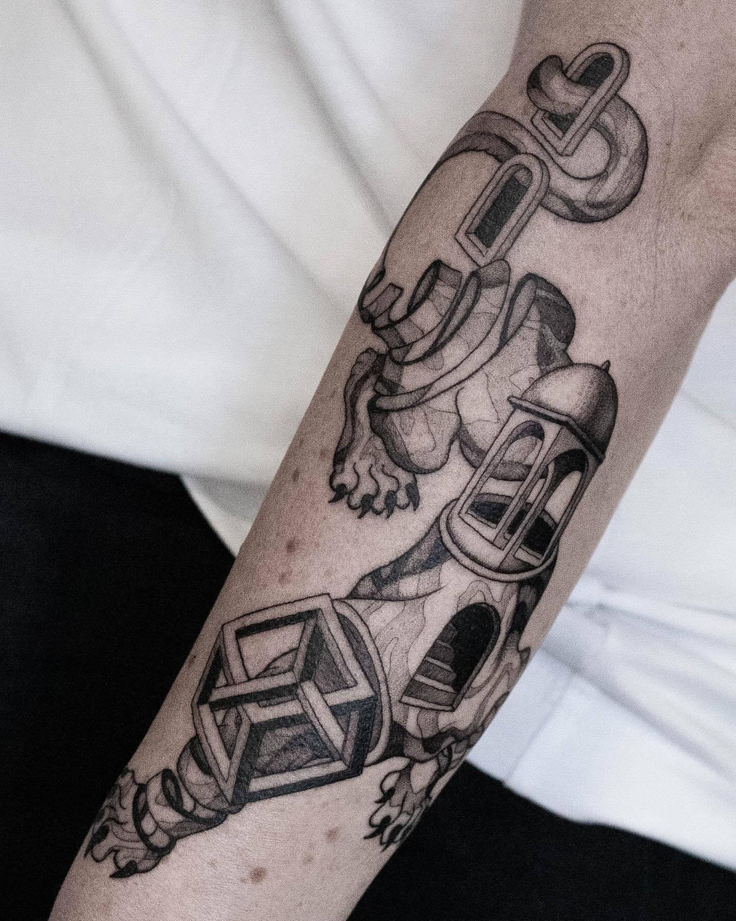 For Nata I created a variation of a deconstructed tiger, incorporating elements of M.C. Escher and architectural forms. Thank you Nata for this inspiring project, it was a pleasure to design this piece for you.
#blackworktattoo #surrealism #tattooart #graphicdesign #finelinetattoo #psychedelictattoo #eindhoventattoo #flashtattoo #tattoo #dutchtattooer #tattoodesign #tattooeindhoven #minimalistictattoo #blackwork #illustration