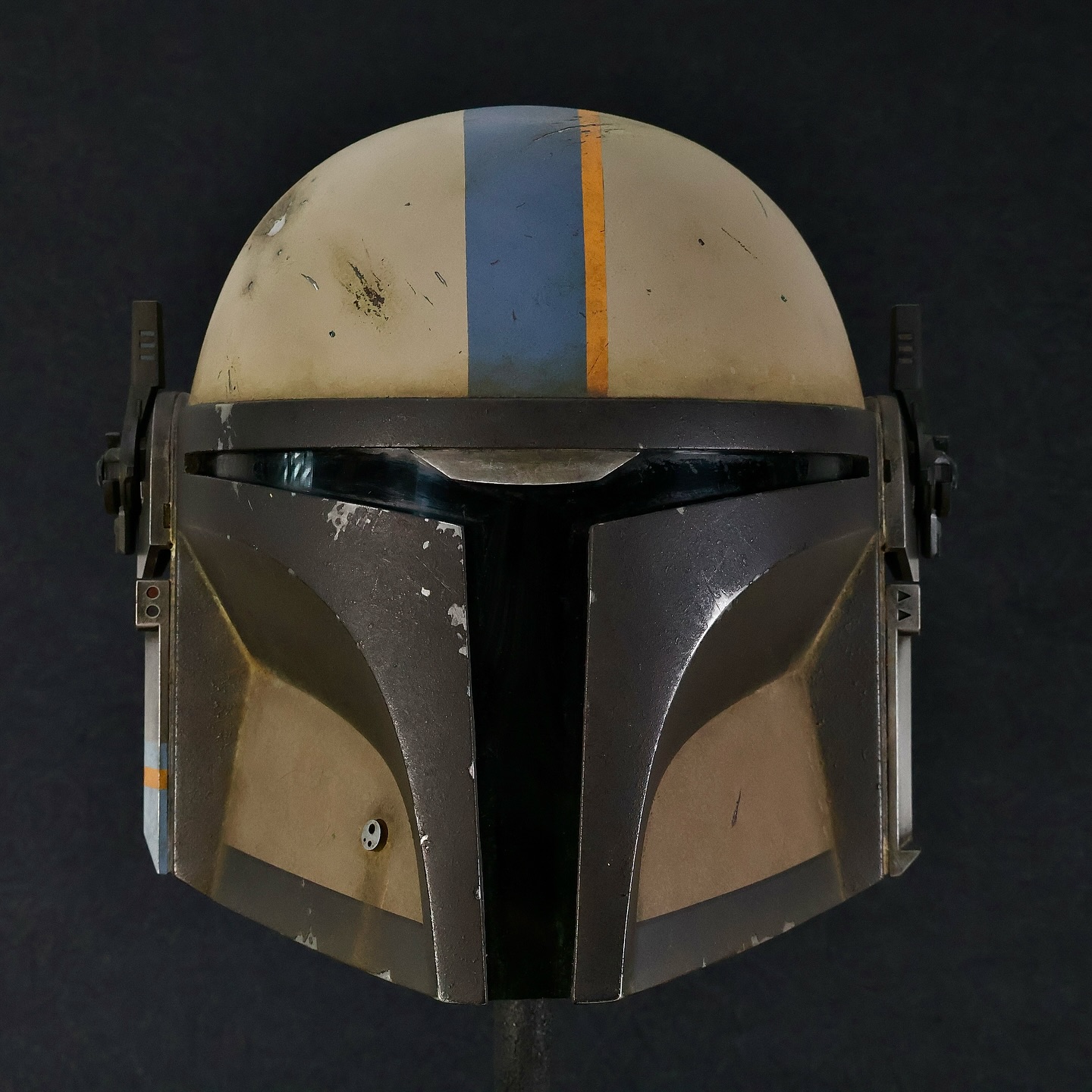 “The Trandoshan was waiting for me, concealed behind an outcropping of rock near the cliff wall. The first shot slammed into my helmet, nearly knocking me off my feet. The second and third went wide, thudding into the dirt somewhere behind me and to the left.
I recovered quickly and activated my helmet’s MHAS. The sensors locked on instantly, painting a red marker over his position in my HUD.
A few seconds later, the cliff wall behind him exploded—showering the area with molten rock, twisted metal, and whatever Trandoshans are made of.
They always send such amateurs after me…”
-——///-——
This was the very first “G.I.” helmet cast I ever made, back in 2019. At the time, I gave it a simple all-white spray paint job, but it was never truly finished—it mainly served as a demo and test piece for my MHAS accessories in the shop.
In November 2022, I finally decided to give this lid the love it deserved. I stripped off the old paint and gave it a proper paint job, complete with a fully finished interior. Now, it hangs contentedly on my wall alongside some of my other helmets.
I’m currently working on the G.I. V2 master, which will be cleaner, sharper, and include a few design updates. If all goes well, I hope to start offering casts within the month!
Thanks for looking!
#mynocksden #starwars #mandalorianhelmet #mandalorian