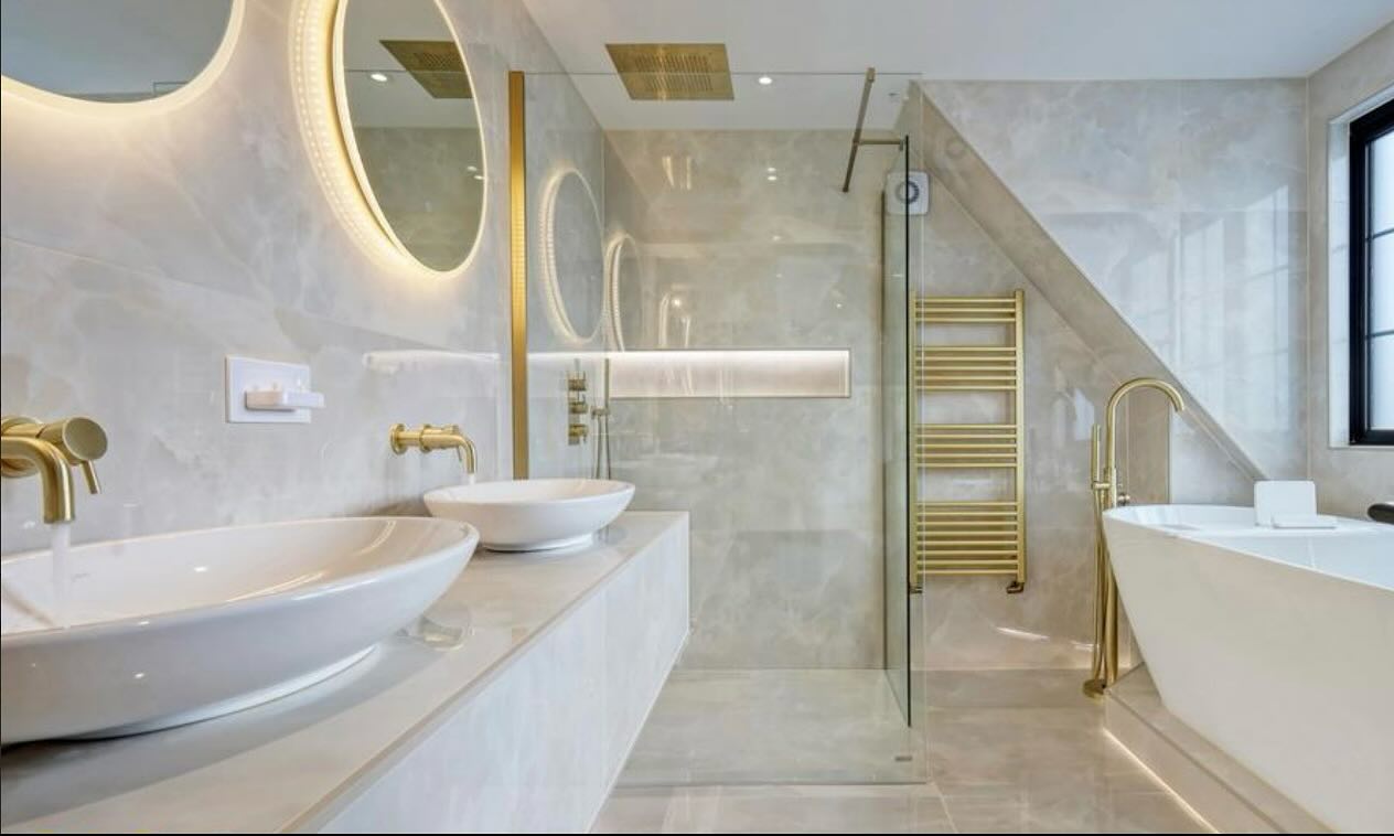 Beige onyx tiles, Villeroy and Boch sanitary ware and clear glass shower enclosure, creating a modern yet classic space.
