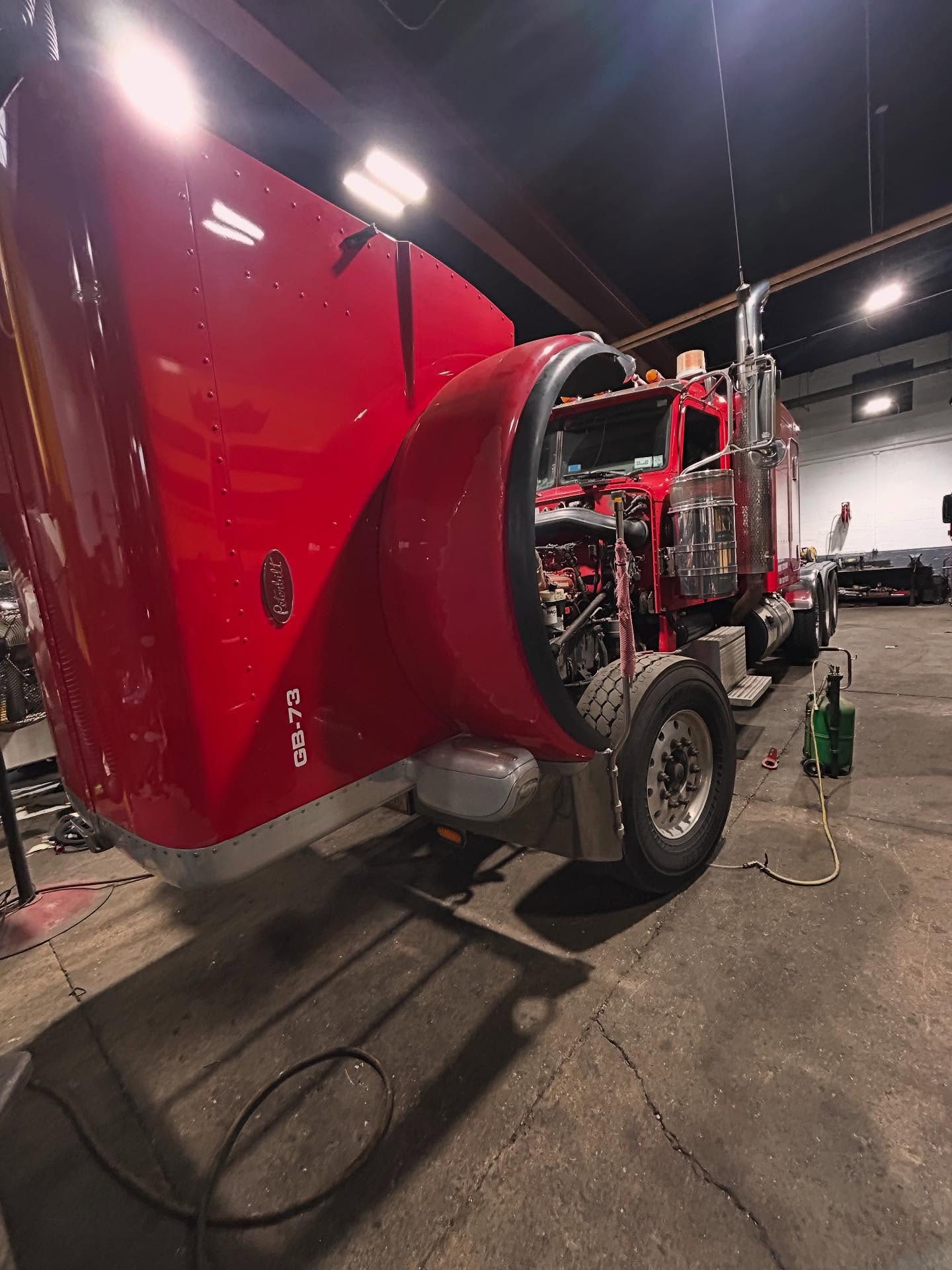 2013 Peterbilt 389 in for Check Engine Light “She came in rough, misfiring and down on power — bad injectors were the culprit. Time for a fresh set of injectors. #ShopLife #CumminsX15 #PeterbiltPower #InjectorProblems”