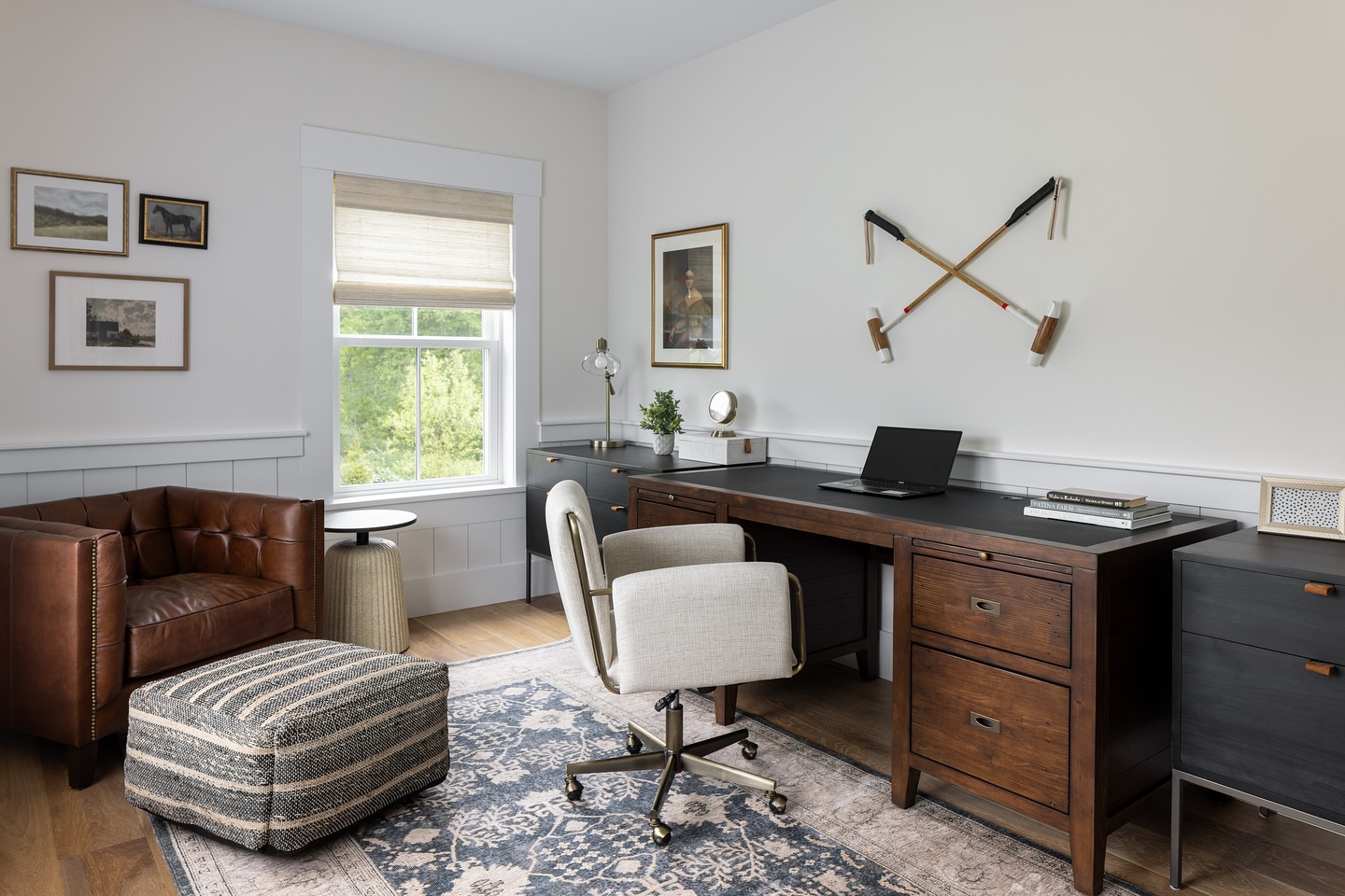 A workspace tailored for focus, function, and a touch of equestrian flair! Rich wood tones and leather warm up crisp white walls and custom polo mallets add that personal touch. Who wouldn’t want to work in this space?
.
📷: @ggray_photo
.
.
#equestrianstyle #custominteriors #workspacedesign #luxuryoffice #masculineinteriors
#threesparrowsdesign