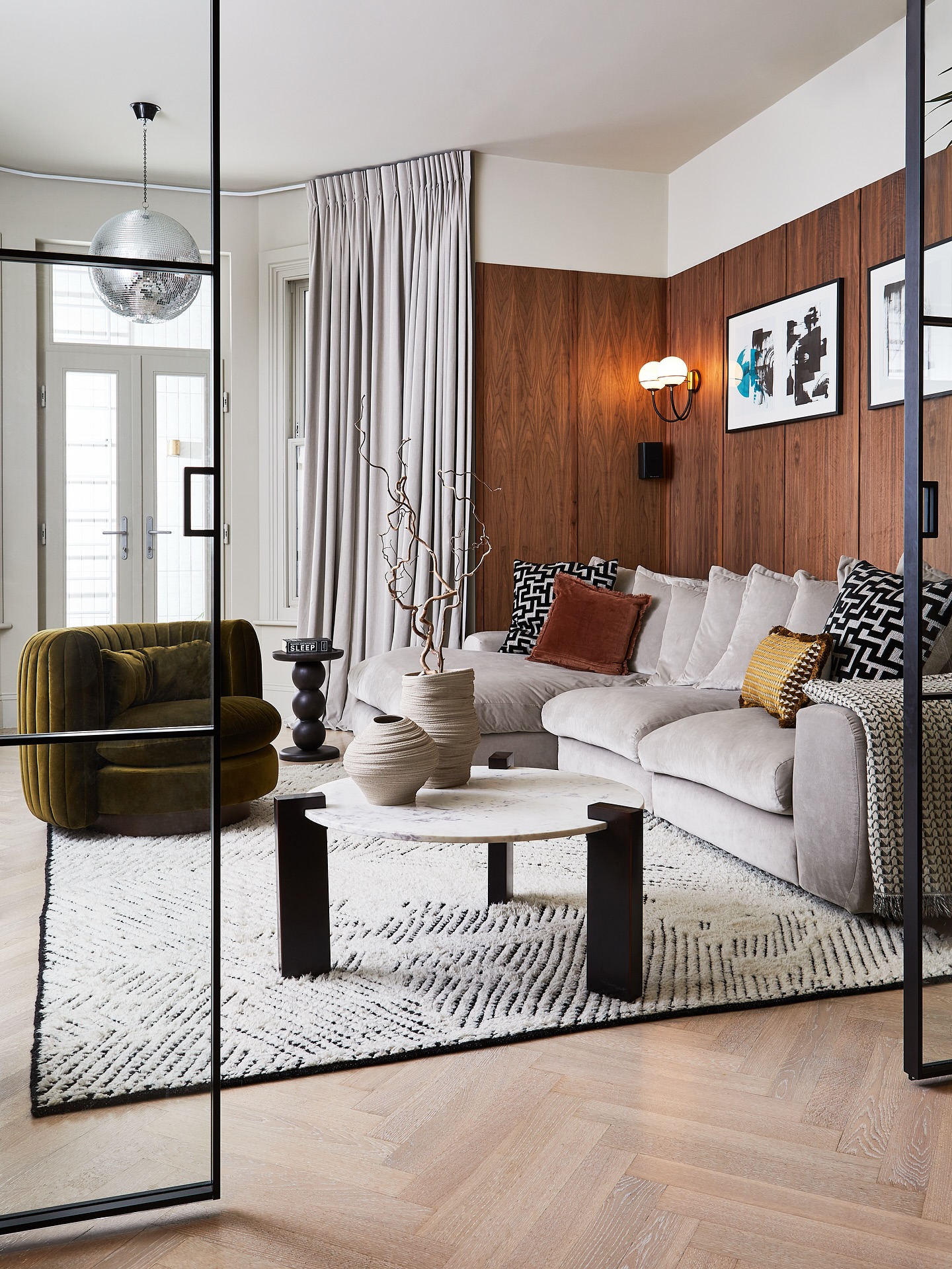 SW11 Project — PART TWO
Following on from yesterday’s post… here’s another view from the other side of the epic basement transformation in our SW11 project.
My clients had done an incredible job with the digging and creating this mega space – but felt it was still missing something: feeling.
Swipe for the befores and a few ‘what we did during’ moments.
We turned this end into a family-friendly cinema snug – zoning the huge space, adding walls and doors to shut away the noise and play, and bringing in big, comfy sofas to bed down on.
As always, it’s all in the planning.
The Pelotons? They now live in a fully thought-through gym zone at the opposite end. Relocating them freed up space, defined purpose, brought in more light, and made way for a much more generous, well-considered gym area elsewhere. (More on that another day!).
And that walnut panelling? Giving all the warm, mid-century-inspired, timeless vibes. We love it so much.
Being a basement with limited natural light, it was a balancing act of warmth yet still light. We layered warm neutrals in with the warmth of the wood and soft texture to keep it cocooning – without ever feeling heavy or enclosed.
Now it’s a true family hangout – but with a sophisticated edge.
No more ‘basement of doom’ – just a space to feel proud of. ❤️
Design & styling @andthentheywentwild
Photography @still_loljohnsonphotography
Comfy seating
Mid century vibes
Walnut panelling
Homely feel
High ceilings
Open-plan basement
Interior design
Warmth and texture
Tired space
Room transformation