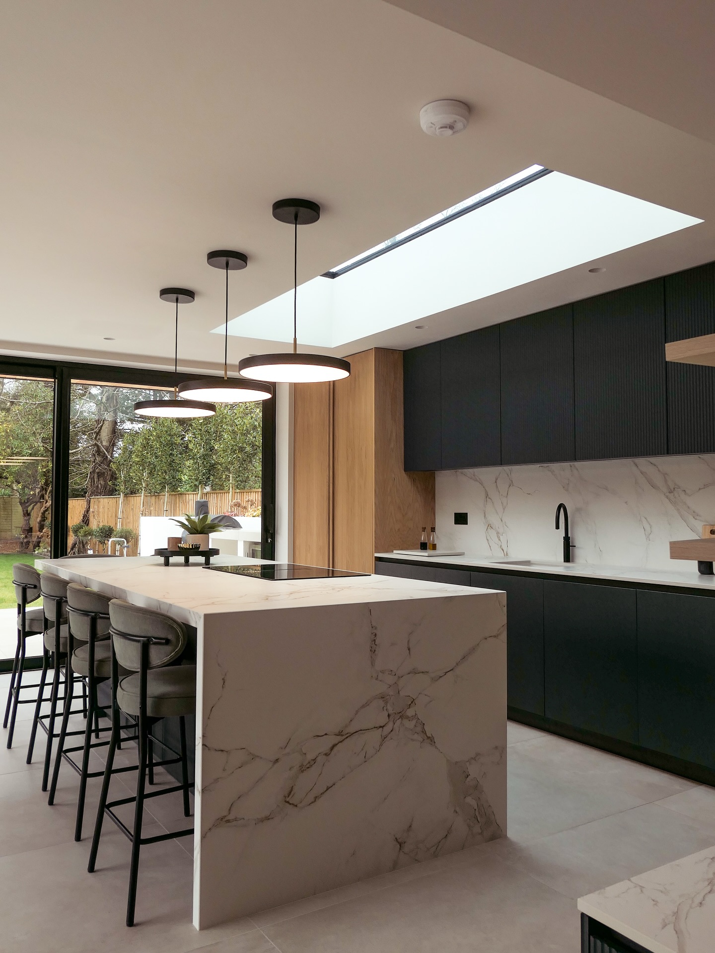 A calm, contemporary space with clean lines and natural textures.
This WCI kitchen brings together soft timber, fluted cabinetry and a marble feature island. A carefully crafted material palette balances the clean minimal design with depth and texture.
Stylish, warm and bright.
#WCI #BespokeKitchen #KitchenInspo #ModernDesign #NaturalMaterials #JoineryDetails