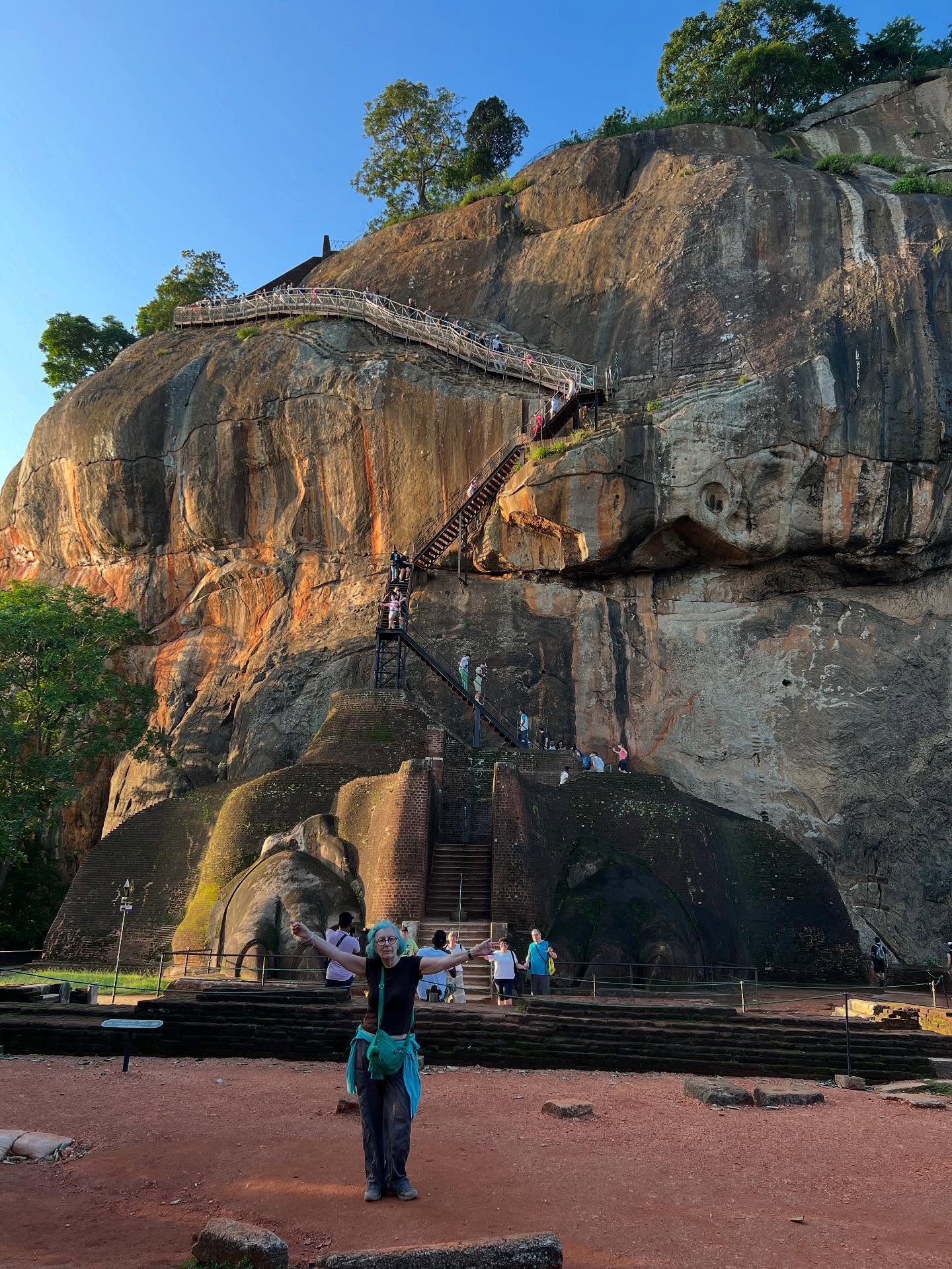 I rise pre-dawn to ascend Sri Lanka’s Sigiriya Lion Rock, the 200-metre-high remnant magma plug of an extinct volcano. This granite peak – magnificent at sunrise – was the site of King Kashyapa’s fortress capital in 477 AD. Only the idiots with an annoying (and prohibited) drone briefly disturb the peacefulness.
#sigiriyarock #srilankatourism #srilankatoday #srilankaforu #srilankatrip #travelwriter #traveljournalist #insrilanka #srilanka_travel #sigiriyasrilanka❤️🇱🇰 #culturalsrilanka