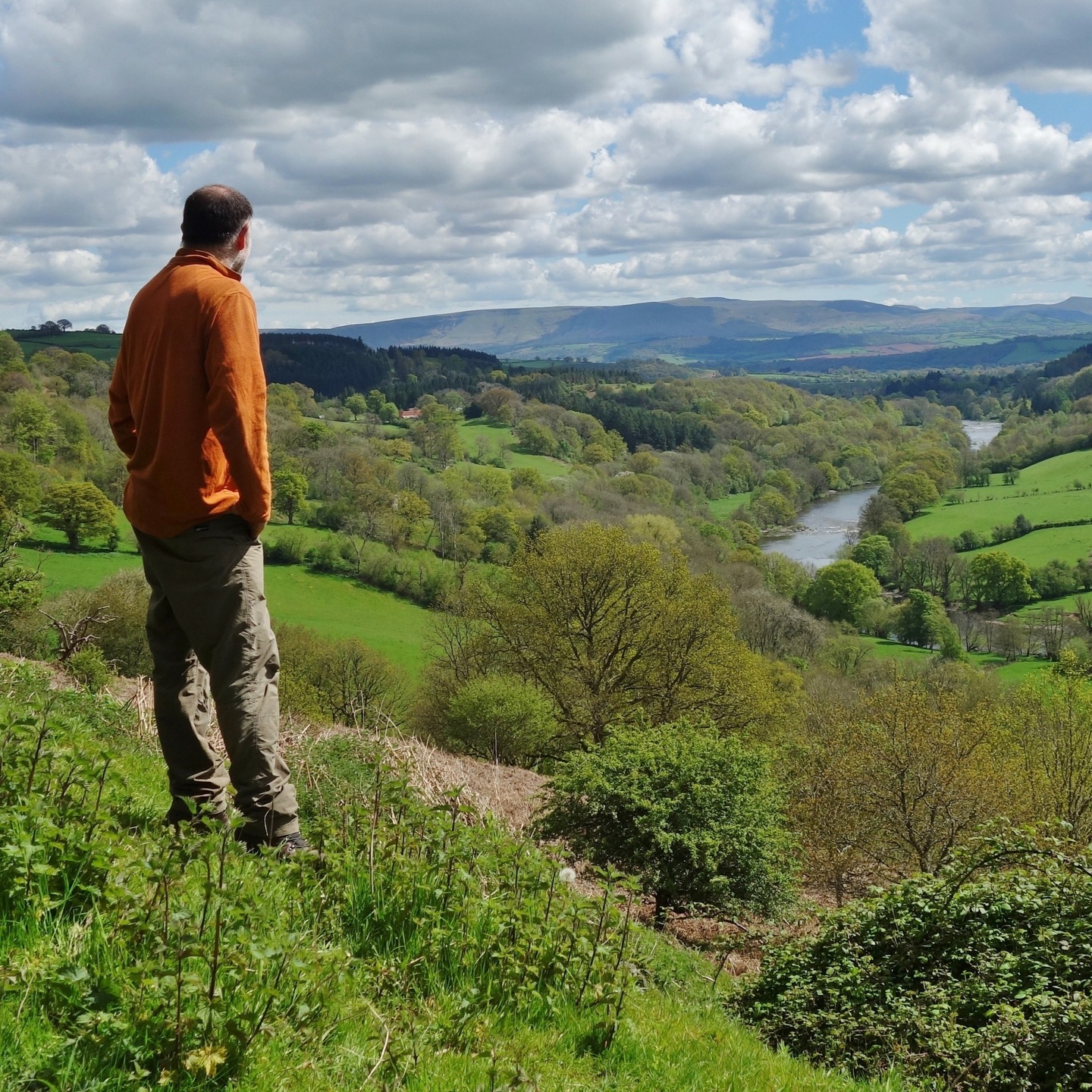 I’ve been wondering about all the views I enjoy in the Wye Valley. There’s an essence of being that flows through me as I gaze. What could it be? I ask myself. It’s not just the pretty view! From where I’m standing, there’s always this feeling of infinity. The landscape stretches before me without a visible end, it appears. And that feeling—of being unbound, of not having limits—is something that resonates deeply within. Regarding us all, it reflects our inner longing for freedom and expansiveness. Boundaries, whether physical or mental, feel constricting. The "open" view, like the one I’m experiencing here, symbolizes liberation from those constraints. I mean, just by looking at the fields, I know there are boundaries in the valleys. But there’s an invitation in the vista to sense and imagine something else beyond the confines of daily life. A limitless being is in the space - so much to do, feel, and see. I breathe it in like I drink water. The view is just above Erwood with the Black Mountains to the east. #wye #wyevalley #riverwye #blackmountains #midwales #walesadventure #walescollective #riverview #valleyview #valley #naturetones #naturefreedom #hikinguk #windingriver #freedomthinkers