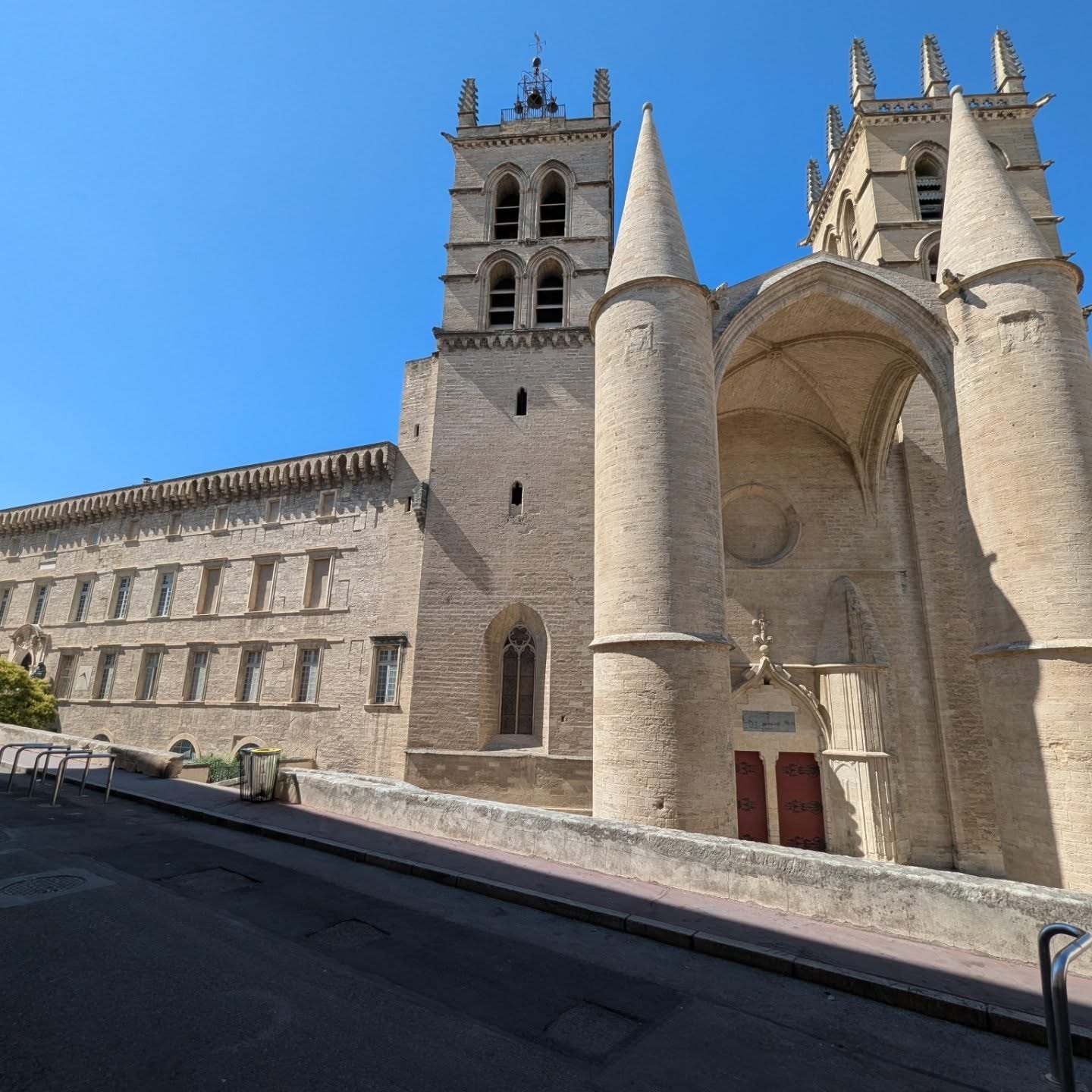 Yesterday was another beautiful day. We visited Montpellier where you can find the mini Arch de Triomphe as well as a medical science building that can only be described as gigantic. The first picture does not give the scale of its immensity, the second picture does when you find my wife near the main doors. The day finished with a light meal and a nice bottle of spiced wine. Life is good.