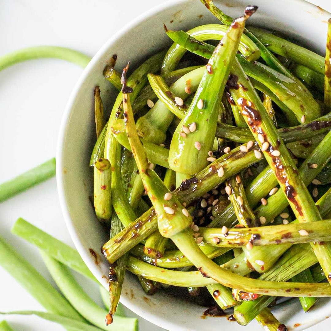 This week’s PACT recipe brings the heat with a quick and tasty Stir Fry Garlic Scapes! 🌱🔥 Swipe to see the full ingredients and cooking instructions #FreshFromTheGarden #PACTRecipe #GrowToLearn