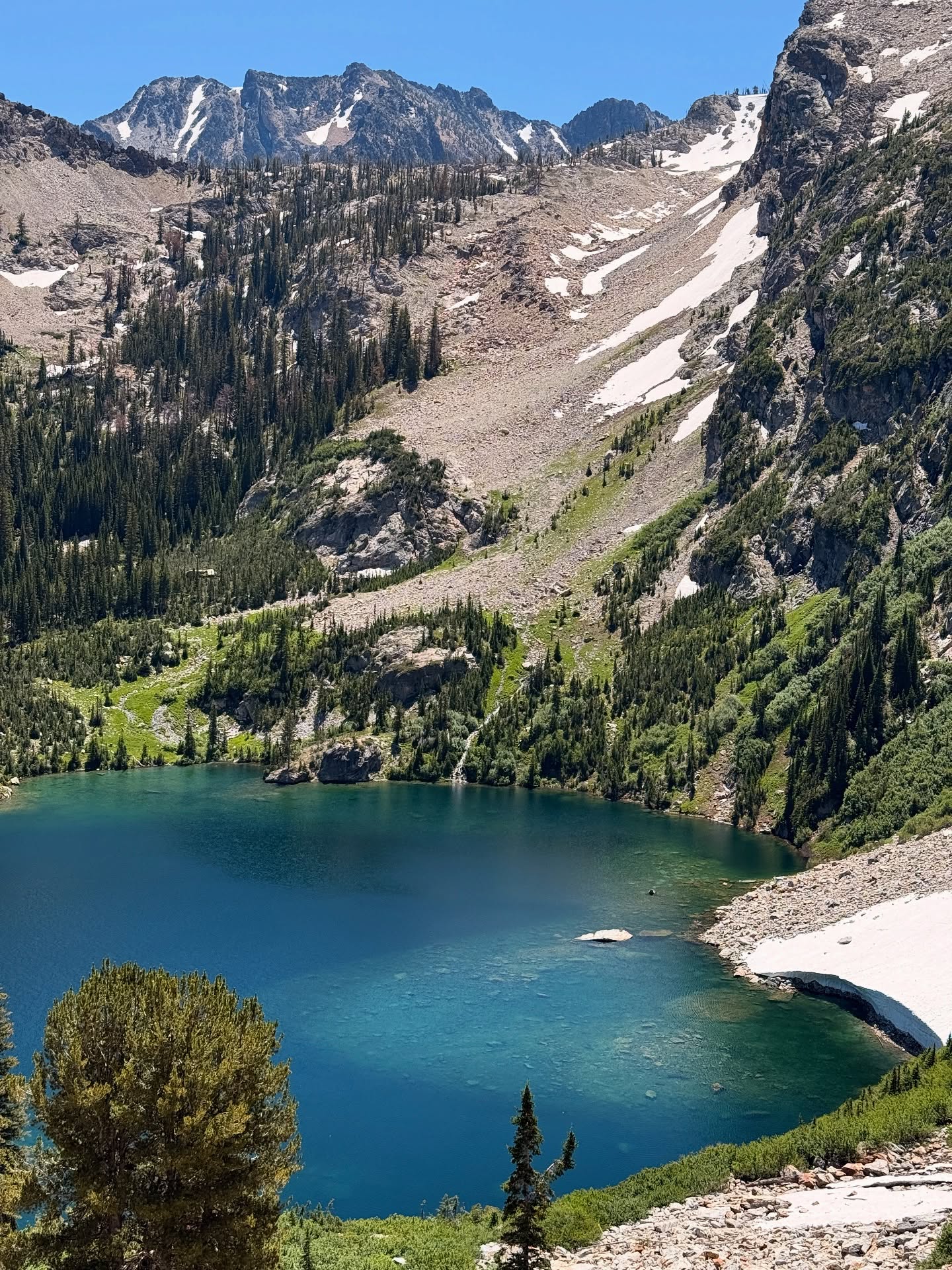 Another big hiking day in the peaks outside Stanley—12 miles roundtrip to Sawtooth Lake and back, and every step was worth it. 🥾⛰️
The smooth, well-graded climb winds through lush meadows and rugged granite slopes, past Alpine Lake before the final push to the summit. We had PB&Js perched on a rocky ledge overlooking Sawtooth Lake—cold, still, and framed by jagged peaks.
On the way down, we stopped at Alpine Lake, where Aria and Randy took swims (they are truly part penguin) and Finn and I dipped our dusty feet in the cold water.
One of our favorite hikes of the trip, and fun to do one Randy has always wanted to do but hadn’t yet. Big miles, bigger payoff.
#sawtoothlake #alpinelake #stanleyidaho #idahohikes #familyadventure #alpinelakes #getoutside #travelwithteens #sawtoothmountains #mountainlover