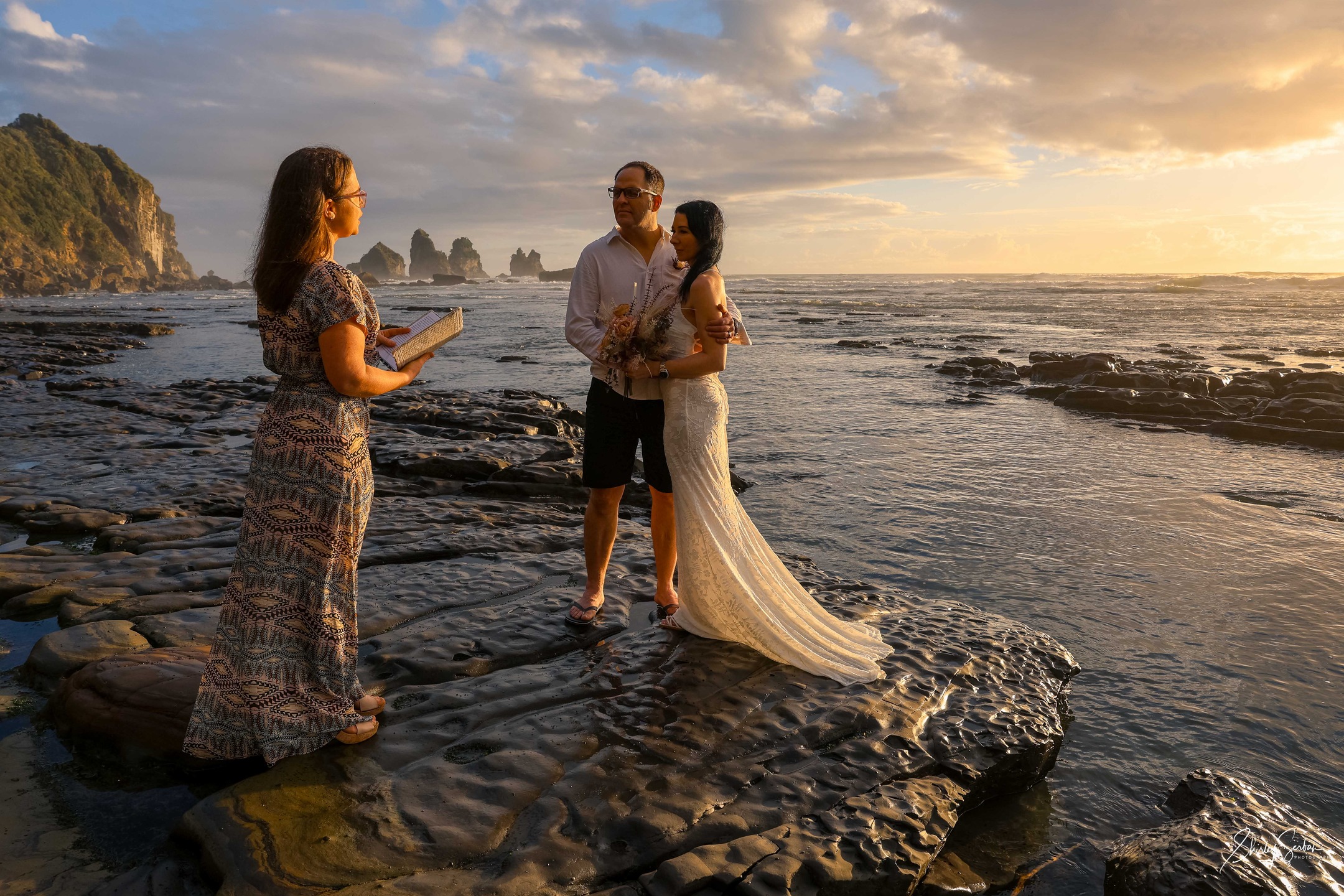 Perfect elopement in a perfect spot, right on sunset. Magical! This was a few days ago and was memorable, not just for the stunning scenery, but for the adventures getting there... what would be worse than losing a ring on the beach along the way? How about both, at separate times - one in the water?
What would be more magical than finding them BOTH? Read more and see more photos on the blog on our website. Elope West Coast dot NZ.