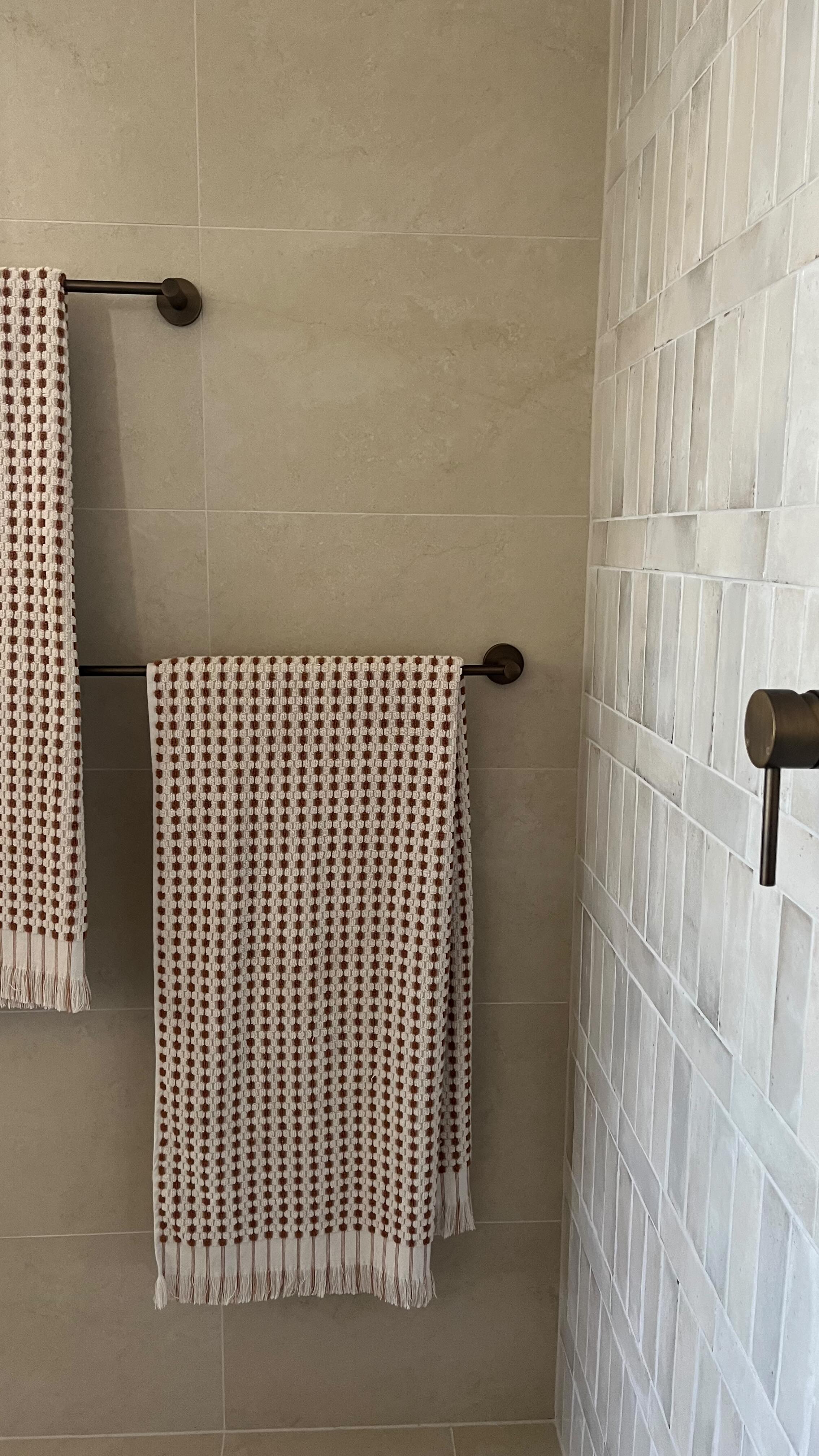 From custom joinery to the hand-tiled shower niche, our latest ensuite design is a layered material story of organic tiles and muted tones.
#interiorinspo #bathroomdesign #bathroomrenovation #designinspiration