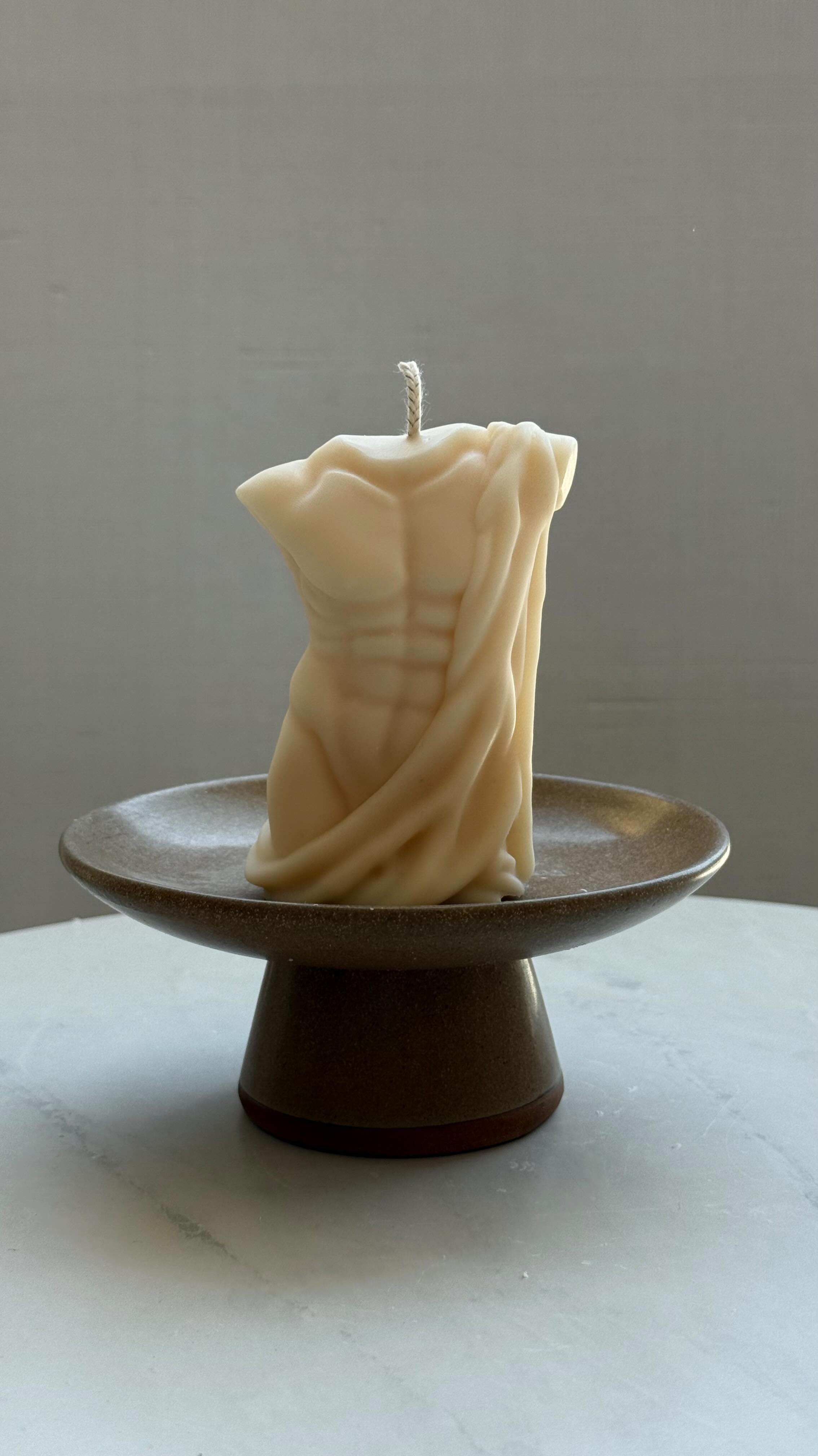 Always place decorative candles on a plate before lighting — they melt differently! And look how easy it is to remove the wax — just let it cool completely and it peels right off.