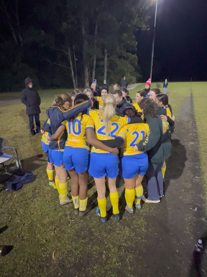 WAA4 Cyclones sing loud and proud after their first win of the season last night! 💛💙
Last night our Women’s All Age div 4 Cyclones with help from a few W45 Thunder took to the field against Chatswood for a round 6 makeup game!
This season the team, comprised with returning players and lots of new players, have worked hard and seen improvements each week. And they have built an incredibly strong team culture.
Last night they came together and fought hard for their first win of the season, coming out with a 5-1 victory!
The goals were flying! A hat-trick from Anna W, an awesome goal from Grace and a cracker goal from Emma T all the way from defence!
Great job girls! We can’t wait to see what else you have in store! 💛💙