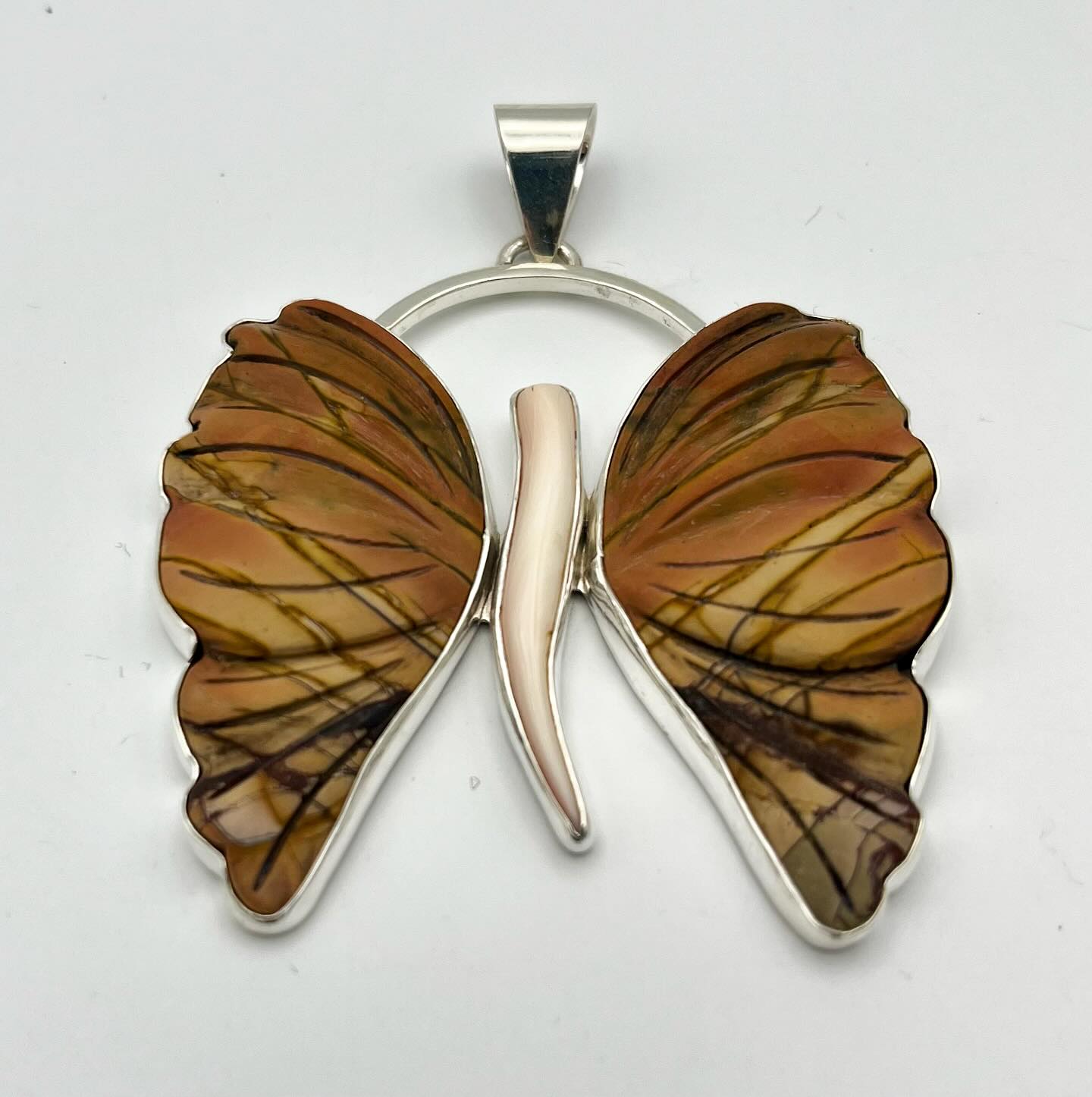 Explore the power of transformation with our “Wings of Becoming” pendant. Made with Red Creek Jasper and conch shell, this beautiful piece is designed to ground and uplift your spirit. Perfect for your life’s journey! Check it out: https://wix.to/4k6TTKs #Transformation #Jewelry #UniqueDesign