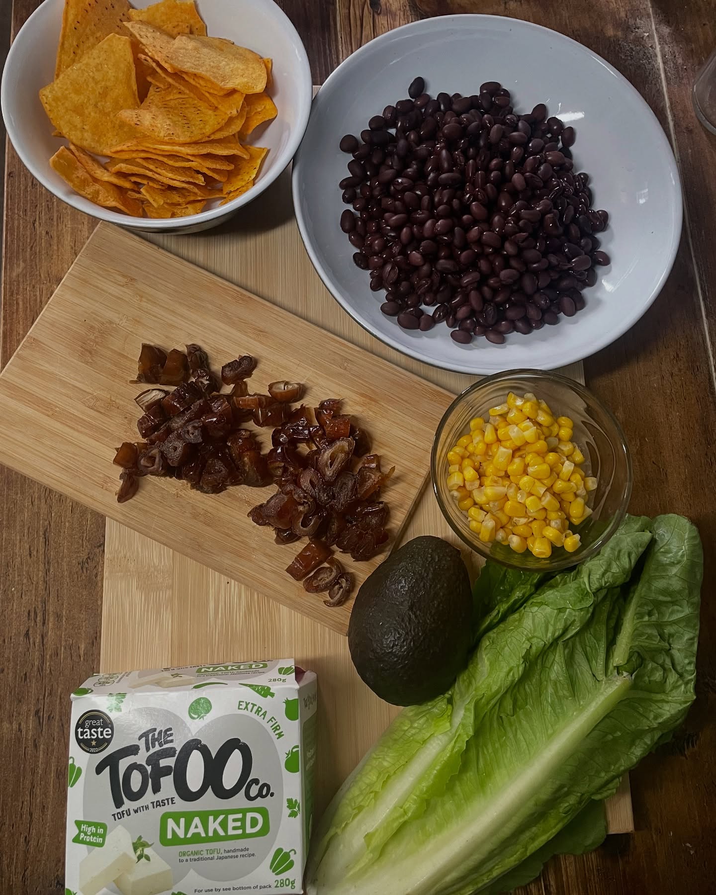 Hot weather calls for fresh, satisfying meals and a well-balanced salad can be just that. In Canada, hearty salads are often featured as mains on restaurant menus. I haven’t found many UK spots that offer the same, so I have to make my own.
This recipe is inspired by a favourite restaurant from back home and is a meal my friend Carla and I used to enjoy regularly. We loved it so much, we started making our own version and it’s been a staple ever since.
A balanced, nutrient-dense base:
* Romaine lettuce (high in water and crunch)
* Sweetcorn (for natural sweetness and fibre)
* Black beans (plant-based protein and fibre)
* Avocado (healthy fats)
* Chopped dates (adds natural sweetness to offset spice and acidity)
* Feta (optional—adds saltiness and calcium)
Dressing:
Blend together:
¼ cup olive oil
¼ cup hot water
1/4 cup pumpkin seed butter (or tahini/peanut butter)
1/4 cup lime juice
2 tsp tamari or soya sauc
2 tsp maple syrup
1 clove garlic
Protein options:
Chicken: Season with jerk spice, then BBQ or pan-fry and slice.
Tofu: Tear into chunks, coat with cornflour and jerk seasoning, then pan-fry until golden.
Finish with a handful of crushed tortilla chips for crunch. A complete, flavourful meal with protein, fibre, healthy fats, and plenty of colour on the plate.
#NutritionalTherapy #FunctionalNutrition #EatForEnergy #GutHealthNutrition #HealthyHormones #BalancedPlate #SummerSalad #WholeFoodNutrition #ProteinRichMeals #FibreIsFuel #BloodSugarBalance #PlantFocused #QuickHealthyMeals #SaladInspo #MealPrepIdeas #DairyOptional #GlutenFreeOptions #DigestiveHealth #FeelGoodFood