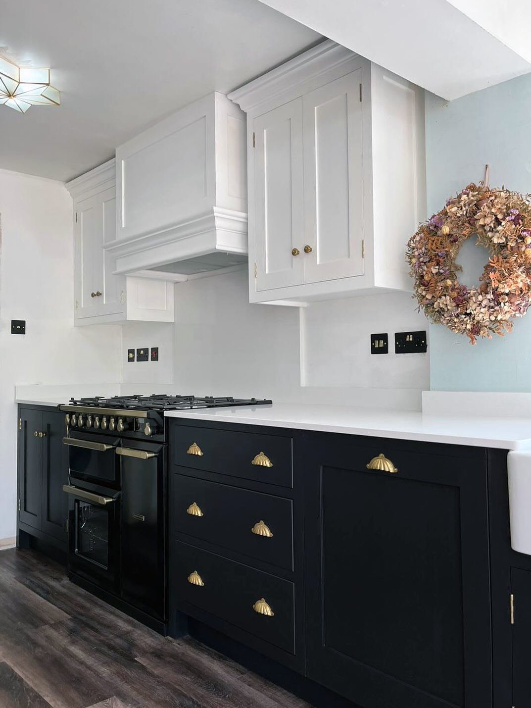 Bold, daring and elegant, this black kitchen is surprisingly gentle and soft and giving a very pared-back and comfortable feel to this room. Designed very thoughtfully with understated cupboard runs, and appliances subtly integrated into this kitchen to make it look as seamless as possible. #jharriskitchens