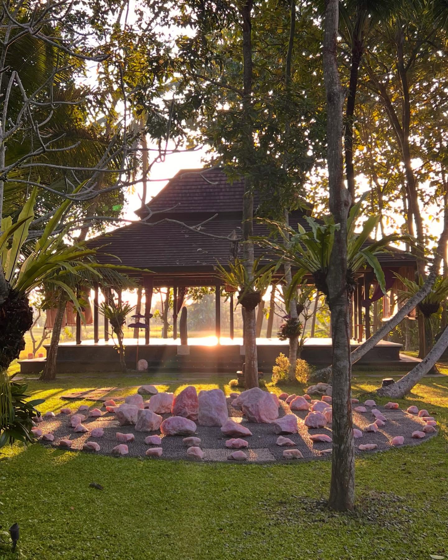 One of the many magical moments from my recent trip to Bali was walking the rose quartz crystal labyrinth at Villa Crystal Castle. The entire property radiates a high-frequency energy, lovingly curated by the owner, who has sourced large crystals from around the world and placed them throughout the villas and sacred spaces.
This particular labyrinth is crafted from rose quartz and designed as a reflexology-enhanced path. River stones, placed vertically to form the base, make walking it a conscious, embodied experience. The subtle discomfort underfoot slowed me down, grounding each step in presence which, I’ve come to realize, is the most powerful way to walk a labyrinth.
A labyrinth is a single, winding path that leads to a center and back out again. Unlike a maze, it’s not designed to confuse but to invite inward focus. It’s often used as a walking meditation, a sacred tool to quiet the mind, release what no longer serves, and reconnect with inner clarity.
As I walked that day at sunset, along with two beautiful souls before me, the experience became a profound heart-opening. I shared messages…release, tears and gratitude followed. We each emerged lighter, softer, and more deeply connected.
#heartopening #sacredjourney #stepbystep #meditation #natureheals #bali #ubud #oracle #pinkquartz #villacrystalcastle #crystalgrid @crystalcastlebyronbay