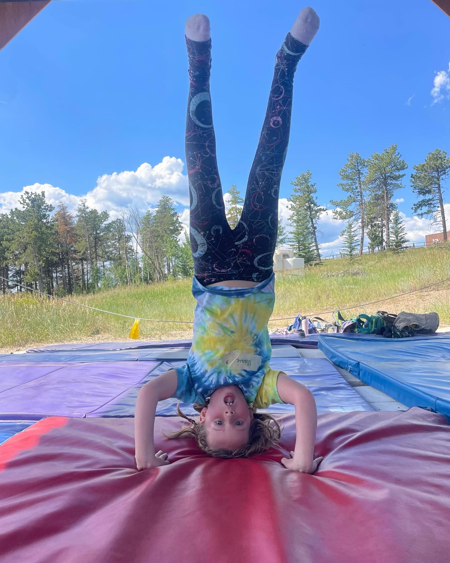 Gymnastics! Campers love going to the gymnastics’ pavilion to stretch, play games, and learn new tricks! #gymnastics #outdoors #summercamp #bouldercolorado #cmr #coloradomountainranch
