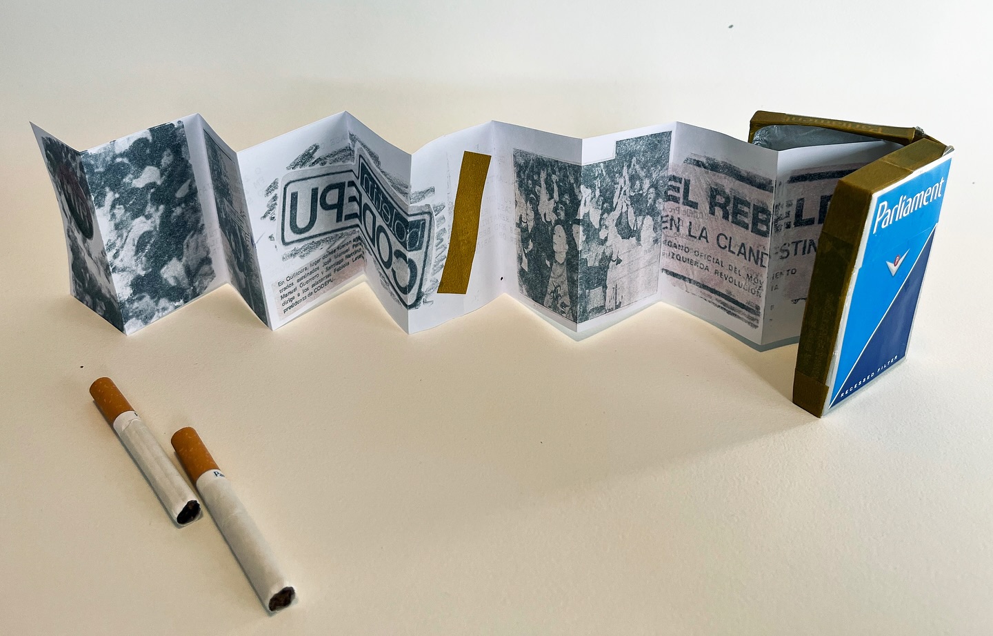 Camila Leiva is a muralist, painter, and comic artist. Leiva was born in Santiago, Chile, during the final years of the military dictatorship and is currently based in Minneapolis, MN. She is the daughter of a Minnesotan mother and a Chilean father who were both part of the resistance movement. Her family was directly impacted by exile and political persecution. Leiva’s work unearths family histories and their ongoing impact on her life, enabling her to find a sense of belonging in her displacement and connect with the generation of Chileans who are also uncovering their family histories. Drawing a line between past and present, she seeks to make visible the lives of women currently facing violence rooted in racism and sexism, but who are also using their agency to resist. Leiva paints bold portraits using saturated colors and creates short comics using watercolor, gouache, ink, and digital art. Her work is done as an urgent response to the need to disseminate and make known the faces and experiences of Latin American women. She understands her art-making as both a tool of denunciation and a means of community-building. Camila Leiva is greatly influenced by the long history of political muralism in Chile, including the Ramona Parra Brigade as well as Violeta Parra, the prolific visual artist and musician. She graduated from the University of Minnesota with an MFA in 2023. Image: “Barretín Book 1” - Paper, transfer images, washi tape, PVA, cigarette box, cigarettes & cigarette foil paper - 2025. @camilalei_ Gallery Hours: Thursday-Friday 10am-5pm and Saturday-Sunday 11am-5pm