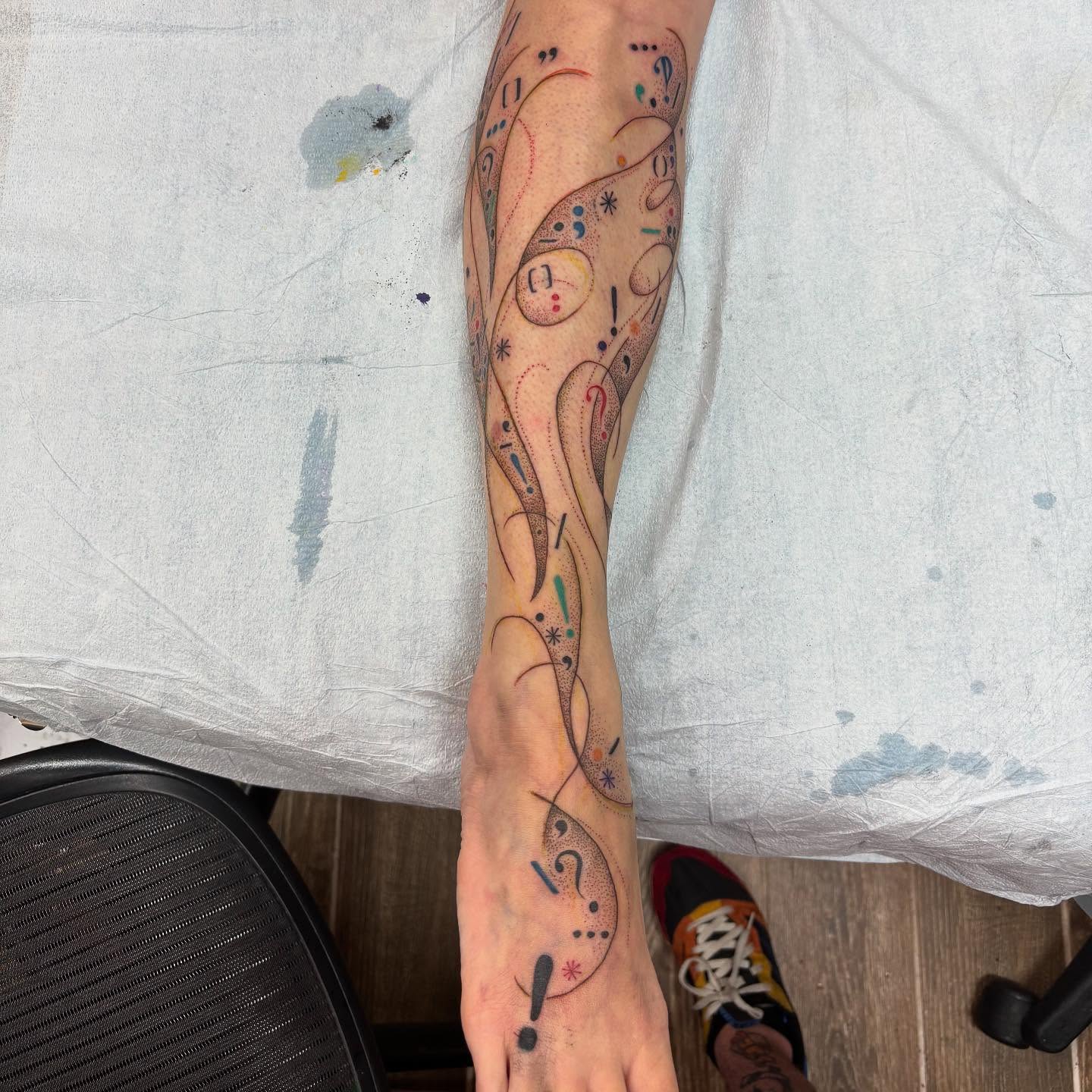 Super cool freehand punctuation tornado~~~~ Had so much fun taking on this idea, lots of swooshy moments ^^ Thanks as always, Erin!❤️🔥 #tattoo #freehandtattoo #illustrative #graphicdesignismypassion #lol #texttattoo #queertattooartist