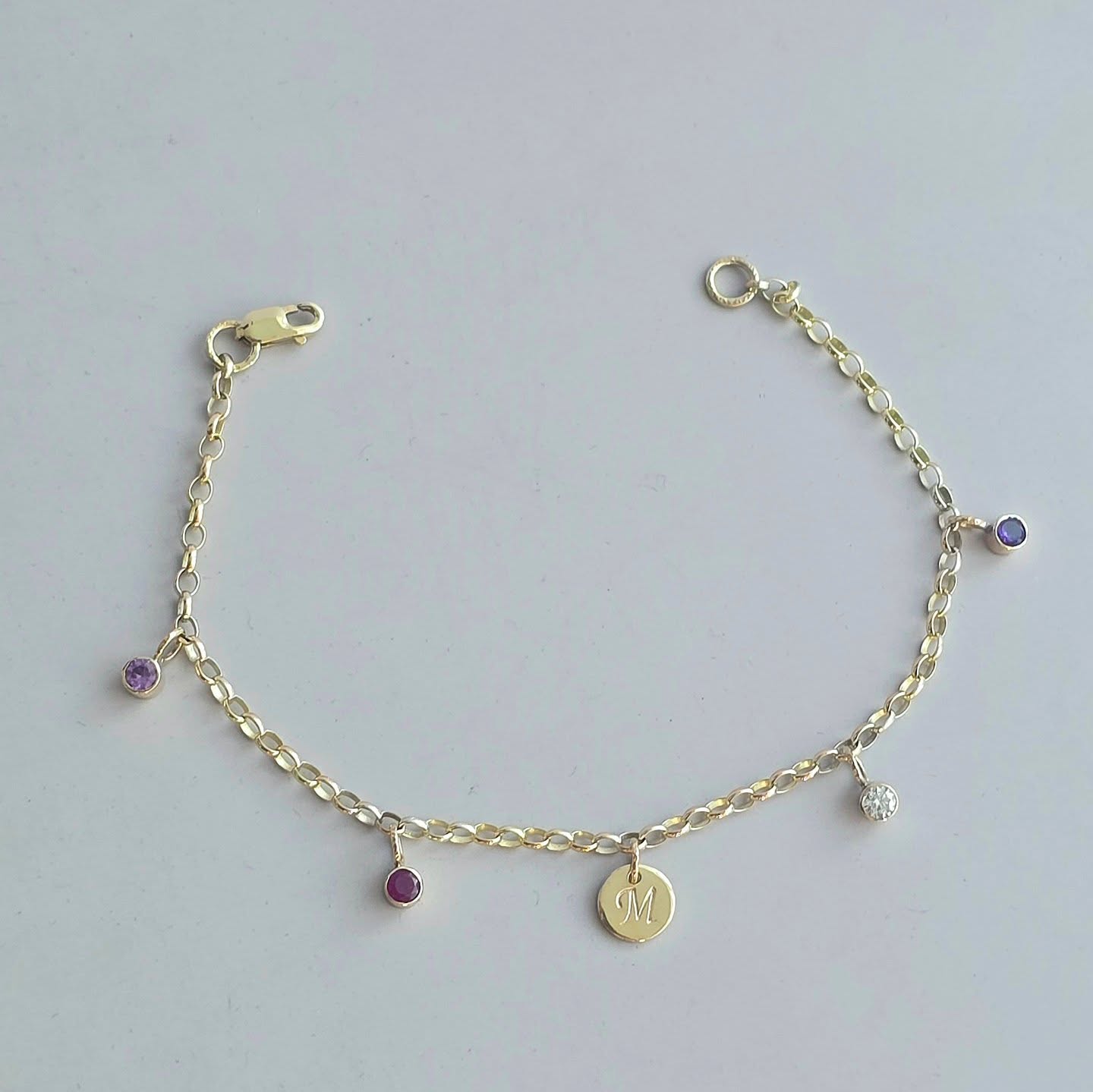 I wanted to show you this beautiful 9ct gold bracelet with birthstone charms and an initial. It was a commission for a special birthday. I also shared some photos of how I made it, which I want to do more of. I made each birthstone charm, and you can see I cut a seat with a burr for the gemstone to sit in.
##jerseyci #handmadejewelleryuk #handmadejerseyci #9ctgoldbracelet #birthstonebracelet #meaningfuljewellery #jewellerywithmeaning #goldcharmbracelet