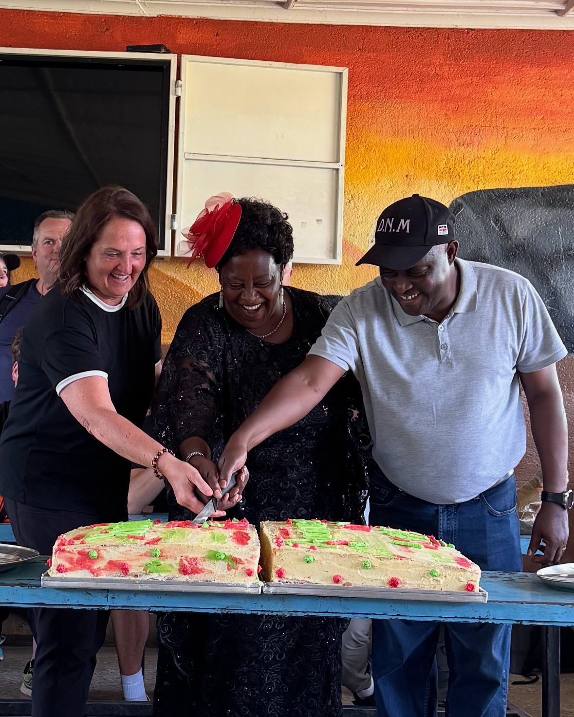 A Full Circle of Service: 25 Years in Kenya
Traveling to Kenya this year felt like stepping into a story written long before me — one crafted by countless hearts and hands over the past 25 years. Youthlinc’s first service site, where seeds of connection were planted decades ago, has grown into something remarkable: a thriving school for the deaf, filled with bright learners and devoted educators shaping futures every day.
We came to celebrate this milestone, but what we experienced went far beyond ceremony. Presenting a commemorative plaque to David, who has faithfully led this effort, felt deeply symbolic — a moment of gratitude not just for his leadership but for everyone who has walked this journey alongside him.
There was a joyful 25th birthday cake served to children savoring every bite. We were greeted with a welcome poem in Kenyan Sign Language, a gesture that moved us beyond words. Team members fluent in sign language connected directly with the students — sparking smiles, laughter, and a shared sense of humanity. It was a reminder that language, in any form, bridges hearts.
Touring the school, I was in awe of the progress: classrooms alive with learning, vocational programs empowering futures. This isn’t just a project, it’s a living community of hope. Seeing how far it’s come since Youthlinc’s early days reaffirmed how small beginnings create lifelong impact.
We planted 25 trees, symbols of resilience and growth. A quick volleyball game reminded us joy transcends language and culture. Seeing the 6th generation of cows, descendants of Youthlinc’s original livestock, showed how service multiplies over time in ways we can’t always imagine.
Leading this team, I carried deep gratitude for those who came before me — especially Shirley D. Michel, whose heart for service built our connection at the Ngala school in Nakuru. This wasn’t just about 25 years; it was about recognizing the power of continuity, relationships, and leadership rooted in lasting good.
The legacy lives on. The circle grows ever wider. 🌍
Sandy Jones
Kenya Team Leader 2025
You can read more about this celebration on the Youthlincer, which can be found through the link in our bio.