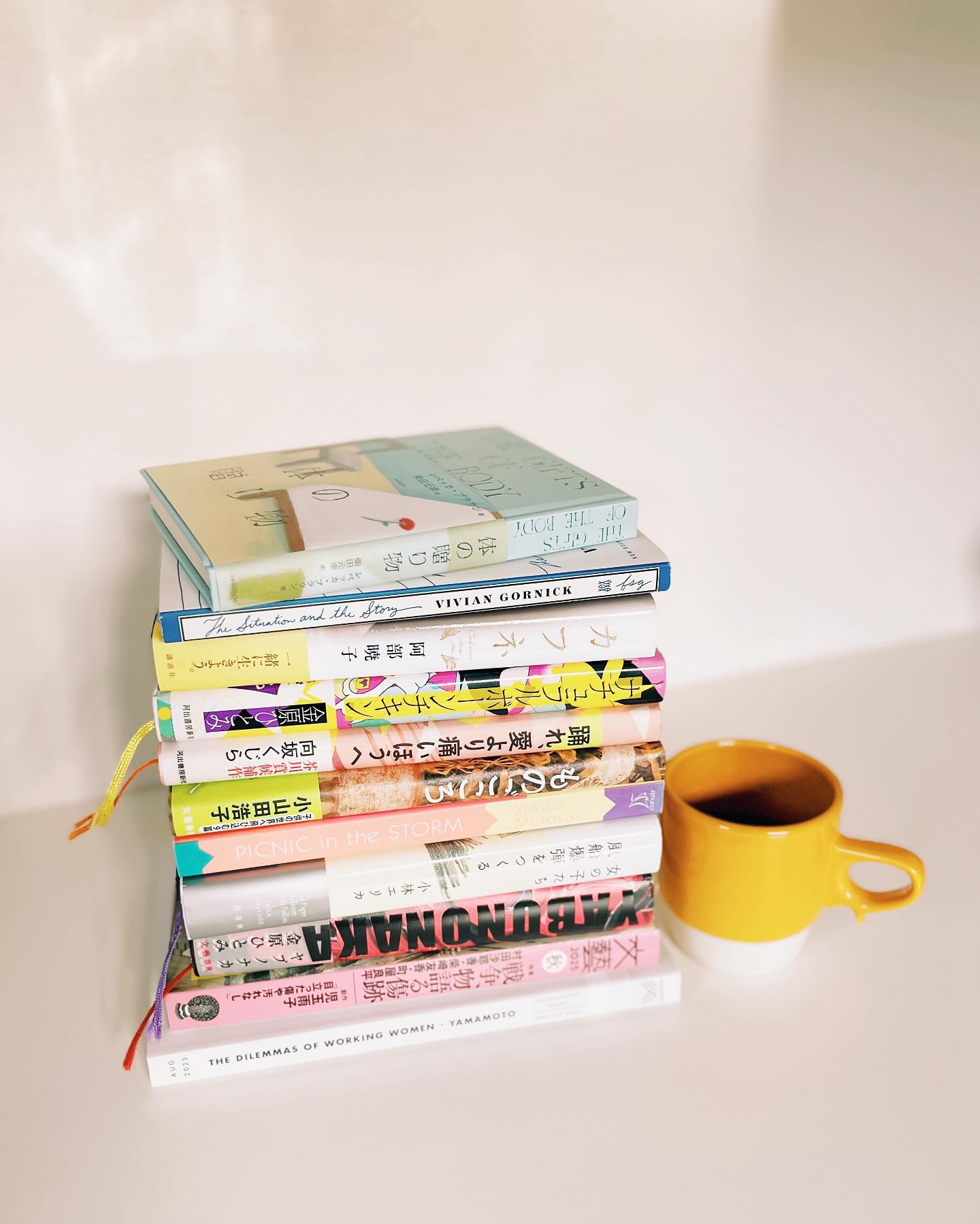 Some books I’ve read and loved recently, mostly new titles in Japanese + a few translated titles that I hope to share in August for Women in Translation month.
The Japanese novels pictured are not yet translated, and include new works by Erika Kobayashi, Hiroko Oyamada, Hitomi Kanehara, Akutagawa-nominated (twice) Kujira Sakisaka, this year’s Booksellers’ Award winner Akiko Abe, and the latest issue of the phenomenal literary magazine BUNGEI. (Which is where many of these novels originate. I dream of doing a series of posts on Japan’s literary magazine scene, as it continues to blow my mind.)
Not to mention Rebecca Brown’s newly retranslated The Gifts of the Body, a beautiful reminder of time, loss, and caring for people in a world where we increasingly do not. (It was an honor to meet and interpret for the author last month in Tokyo.)
My heart also wants to prep a whole series of posts for WiT month (sharing titles other than those I’ve translated, though I would love for people to meet the authors ❤️) but I find I have so few words of my own to share, words that didn’t originate in Japanese by a brilliant modern mind that I get to sit with for hours each day.
That’s where Vivian Gornick’s The Situation and the Story comes in. I needed to find some words of my own. (It was like reconnecting with a best friend.) Hope to share a short essay I wrote (in English) after staring at a blank page for EVER. Coming next month.
I feel scattered as ever but decided to post this today instead of waiting for the perfect moment when the perfect words appear, because then you’ll be waiting for months again. Thanks for reading. Xo
本に埋もれる日々だがシェアできていないので、最近(と少し前に)読んだ本を一部…。📚
日本の小説が現在イギリスで大ブームということはご存知かもしれませんが、翻訳をする私たちもそのスピードについていけず、少し前までは「日本のこの小説が英語で出ましたよ〜」と脳天気にお伝えできていたのが、今はもう速すぎて。(そんな中、自分が翻訳させてもらった本ばかり投稿してすみません…嬉しくて💓)
頭が文字でいっぱいの時は、表紙を含め本の「姿」にやっぱり癒される。美しい本たち、そばで色々語り続けてくれています。
最近、久しぶりに自分の言葉で文章(英語)を書く機会をいただいたのですが、自分の言葉が見つからなさすぎて驚きました。素晴らしい作家の方々の言葉を毎日浴び、一言でも多く、正確に、温度感、質感を失わないよう英語に変換させていただいていますが、「あなたが書いてみたいことは?」と聞かれると、その筋肉がないことに気づく。
上から2冊目の「The Situation and the Story」(Vivian Gornick)は英語の書き方を思い出すために棚から引っ張り出した本。数年ぶりに親友と再会したようだった。(ありがとう、ヴィヴィアン🙏🏻)