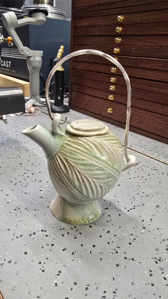 I needed a handle for this little teapot, so I decided to fabricate it from sterling silver because a fancy teapot needs a fancy handle.