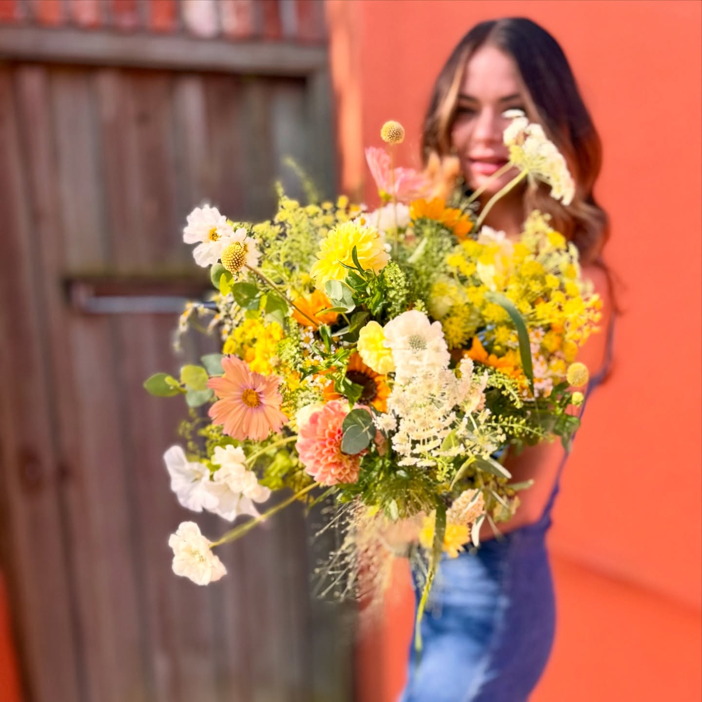 Ketaâs just adorable when she models for us. This weekâs bridal bouquet with sunflowers and tonal yellow flowers captured perfectly in the summer light on a terracotta background. #totnesflorist #devonflorist #localgrownflowers #