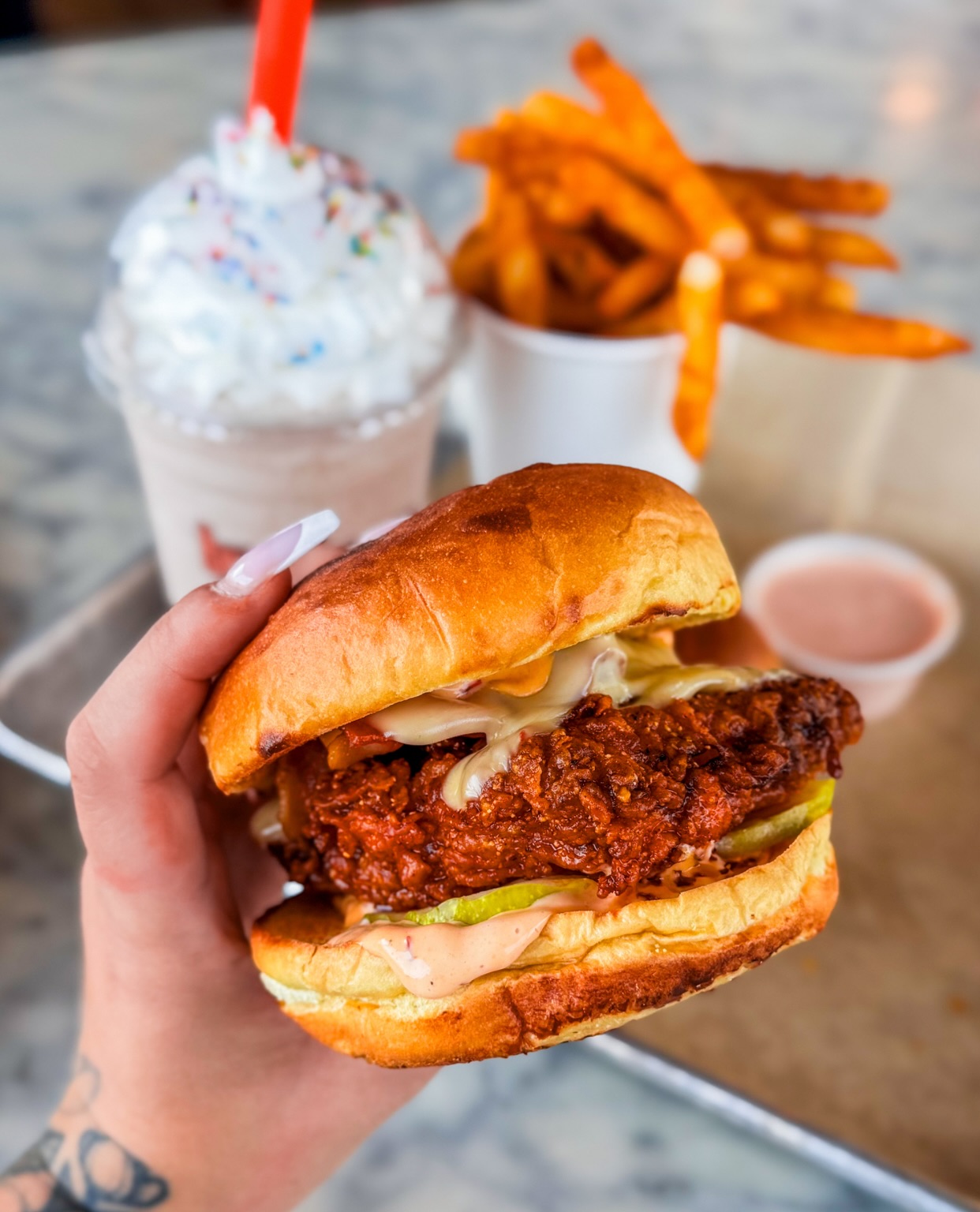The Hot Mess: crispy, spicy, melty, saucy—and all stacked fresh when you order. 🔥