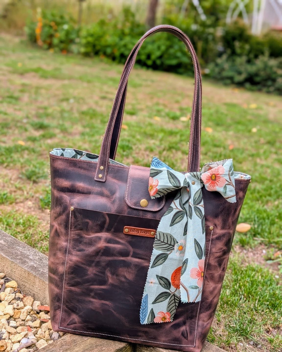 Say hello to your new favorite carry-all!
This gorgeous handcrafted leather tote bag is the perfect blend of rugged charm and feminine flair. Featuring a rich distressed finish, sturdy straps, and a soft floral bow for that extra touch of personality. 🌸
👜 Spacious interior with a handy zippered pocket for your essentials
🌿 Durable & timeless full-grain leather
🎀 One-of-a-kind handmade design
Whether you're headed to the market, office, or a weekend getaway, this tote has you covered in style. 💼🌼
📍Handmade with love. Ready for adventure.
#HandmadeBag #LeatherTote #DitsyBags #CraftedWithCare #EverydayStyle #SupportSmallBusiness #ToteBagLove