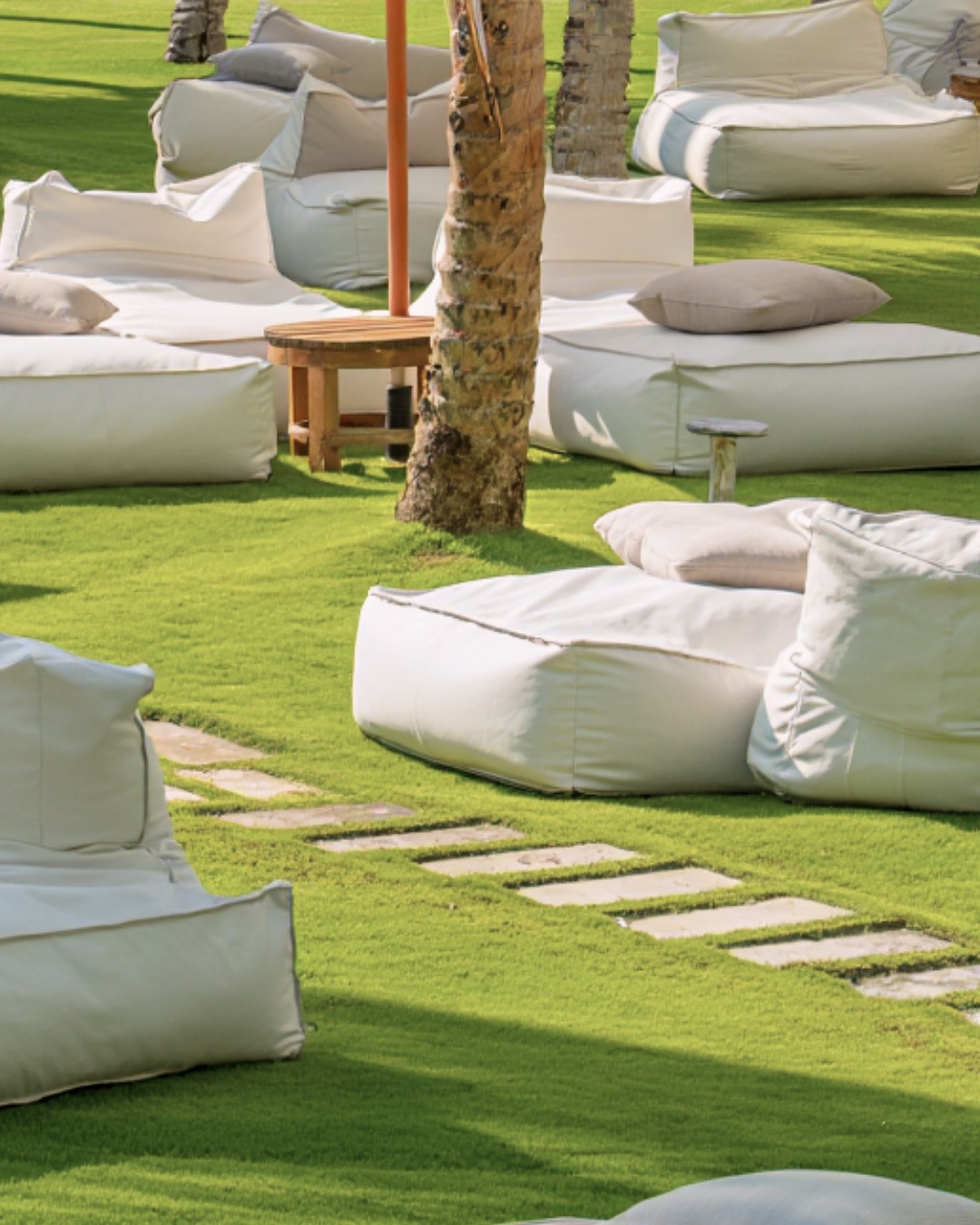 Nestled in our tropical lawn, the low-slung daybeds invite full retreat.
This is the quieter side of Seminyak Beach.