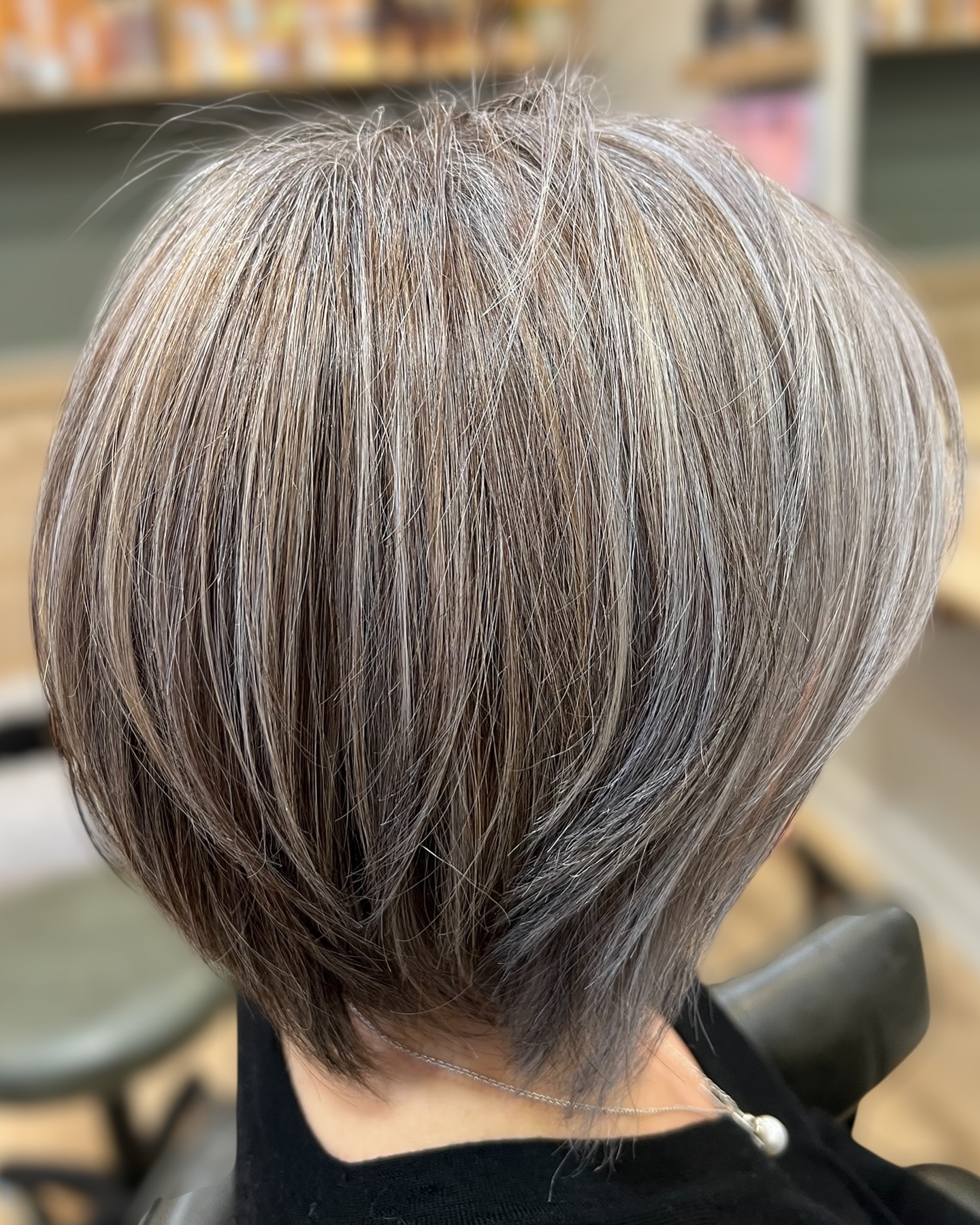 This was a beautiful colour transition designed to blend and mimic the natural pattern of colour and tone in the hair. We originally planned a three-step process, but after just one session, the results were so extraordinary that it will now be completed in just two steps. The second visit will focus on fine-tuning and polishing the remaining areas that weren’t fully captured in the first.
My top priority is always the health of the hair. Before beginning this transition, we allowed just over a month of preparation time to strengthen the hair, ensuring it was in the best possible condition to handle the colour service. I think the results speak for themselves—and it’s only going to get better from here.
If you’re curious about starting your own colour transition—or if you’ve had a few attempts already and still find yourself stuck with visible regrowth or results that didn’t meet your expectations—I highly recommend booking a consultation. It’s the best way to properly assess your hair and set you on the right path toward your goals and renewed confidence in your style.
Natalie Varrasso.