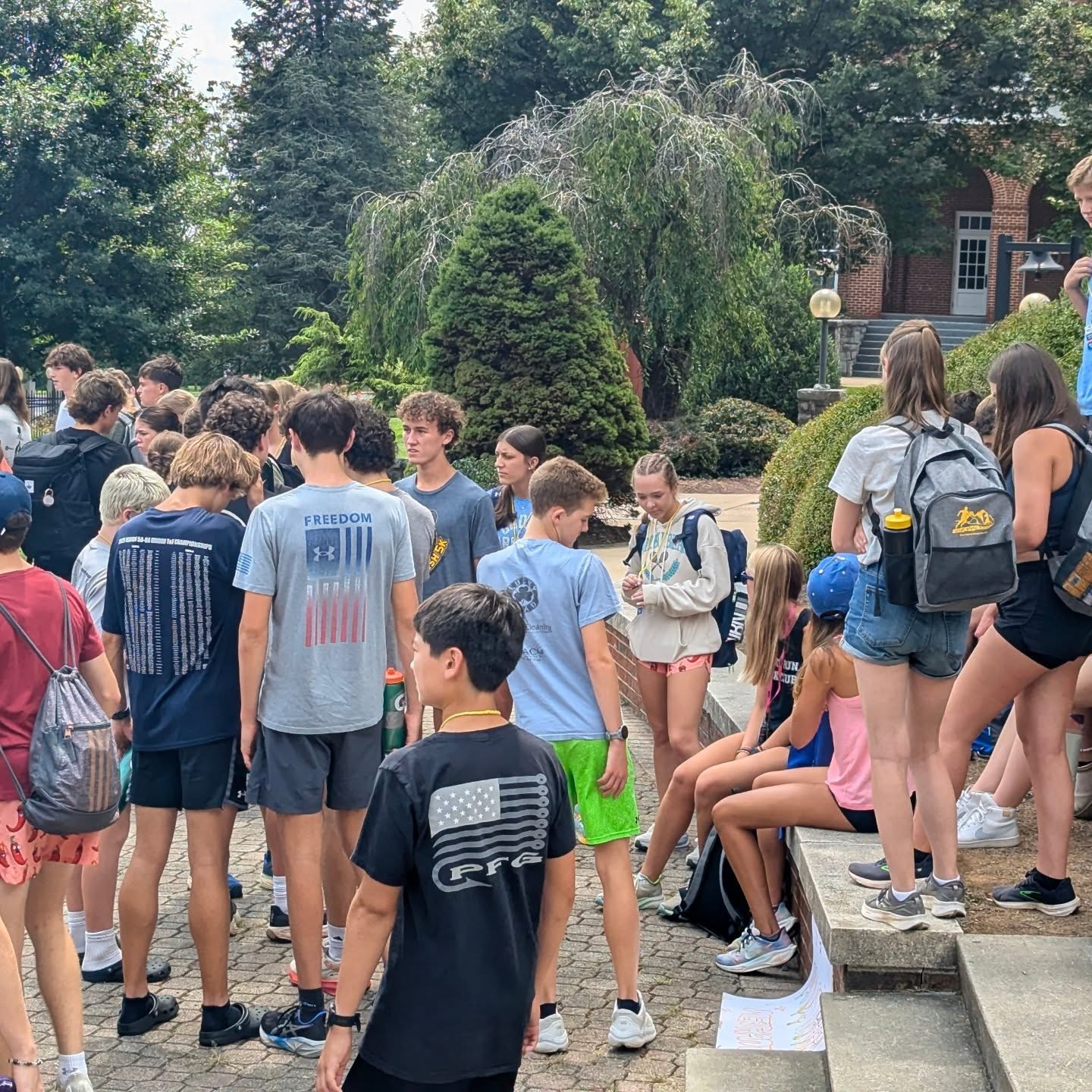 Campers getting ready for their brief afternoon team challenge before their afternoon run