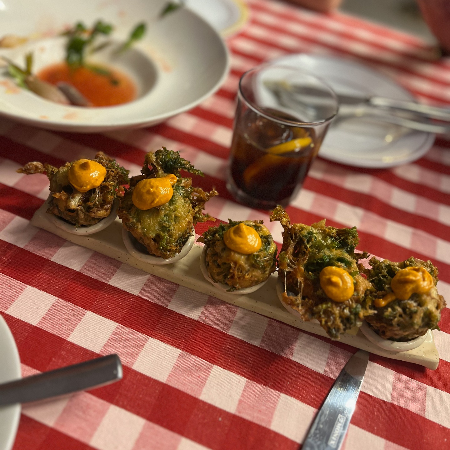 I admit I wanted to go a tourist trap our first night in Mahón, the capital of Menorca. Tiredness, hunger and a lack of planning had me at the gates of the "gastronomic market" aka tourist pintxos.
Luckily Steve, my husband, saved the day by finding this top-notch restaurant @agustin_menorca which at first I refused because of the high number of hipster millenials, the touristy location and the checkered tablecloths. Turns out I was wrong and this was a truly fantastic selection of Menorcan recipes made by a top-notch chef. A quick google informed us that this restaurant, which takes no reservations gracias a Dios, is in La Guía Repsol and that the chef had worked at many Michelin starred restaurants across Spain.
This is what young people call a restaurante or bar viejóven (old/ young). It's a place that feels casual and sophisticated at the same time and were the cool people of Menorca are plotting parties to which you would love to get invited.
The wine list was a bit hipster, the service impeccable and friendly.
1-Escarole fritters and house vermú.
2-Font Major water from Mallorca.
3-Traditional Canelones with truffles (yes this is traditional in the Balearics and Catalonia)
4-Tempura guindillas
5-Sardine coca
7-Traditional Cod fritters
8-Canelés and cinammon ice cream
9-Chocolate cake
Not pictured an incredible salad of tomatoes and cherries and an organic dry cava from Miquel Pons.
#menorca #menorcarestaurant #balearics