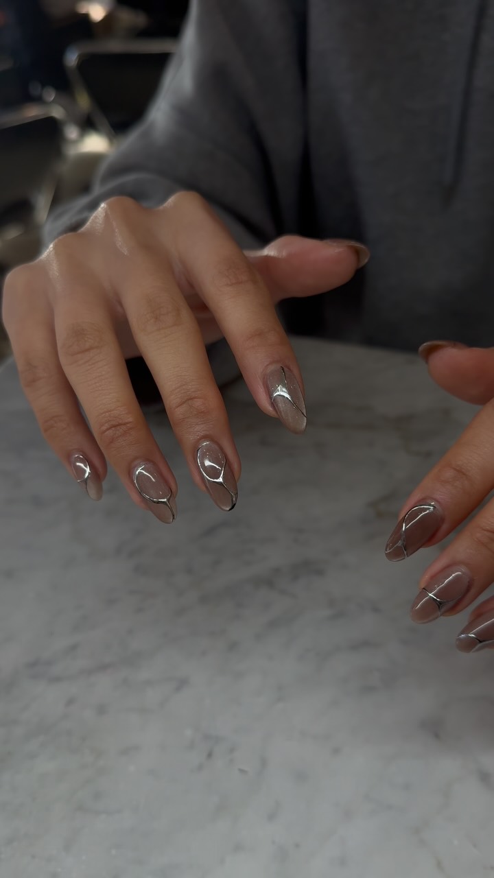 Smoky swirl realness 🖤✨
Nude base kissed with silver chrome waves — understated, elegant, and a little edgy. She’s that girl who lets her nails whisper luxury.
Artist: Trace
#SwirlNails #ChromeDetails #BondiNails #NailGoals #ElegantNails #MinimalistNailArt #SilverChromeNails #CleanGirlAesthetic #NeutralNails #NailTrend2025 #BondiBeauty #ModernNails #GelNailsAustralia