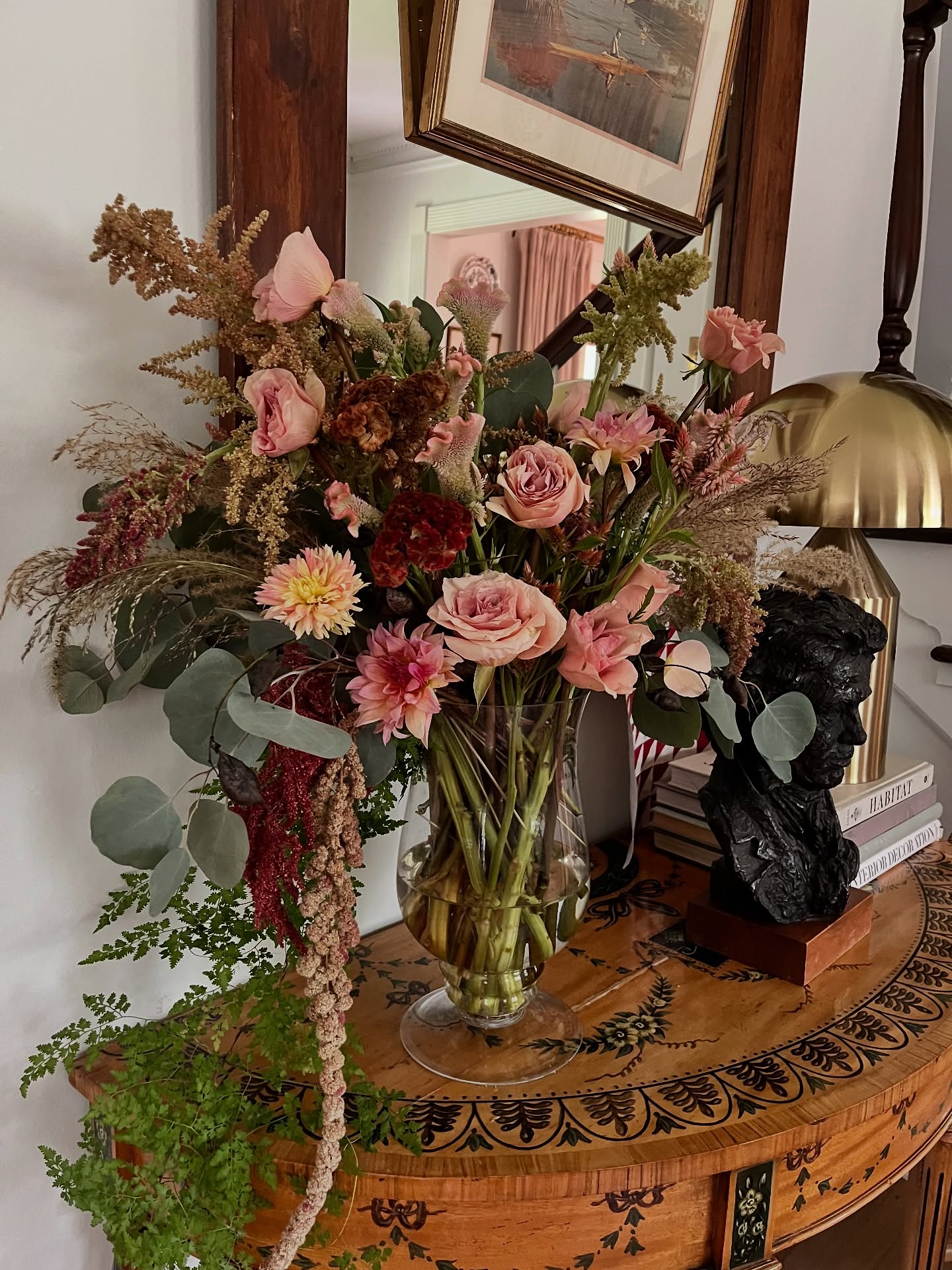 Terra cotta and champagne celosia mixed with muted rose tones for this arrangement destined for @southern_heartland_art gallery. I wanted to use some pieces I previously dried for a more antiqued, tonal effect.
Featuring: celosia, amaranthus, eucalyptus, various dried flora, home-grown dahlia, old roses that were still beautiful, foraged fern vine
Styled at @homeonrabbitfarm