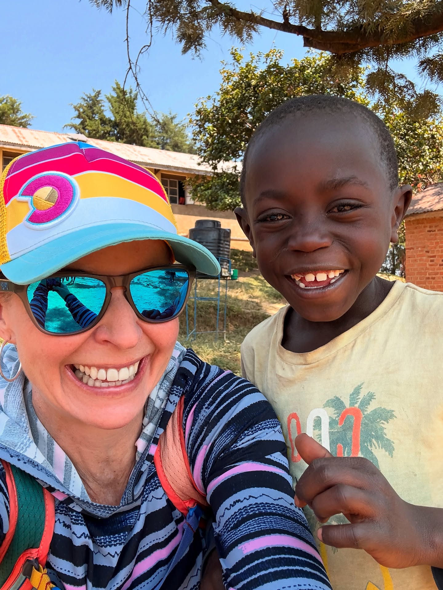 We pulled up to the shore of one of Lake Bunyonyi’s many islands and were instantly surrounded by laughter, hugs, and the eager chatter of schoolchildren who couldn’t wait to greet us.
We were visiting one of the local primary schools where the Global Livingston Institute (GLI) partners, and as a GLI board member, it was deeply moving to witness the joy and resilience of these students up close.
We spoke with the principal—her name is Patience, and it fits her perfectly—about both the progress she has seen over the years and the very real continuing challenges.
Many of the kids arrive without pens or pencils, uniforms or shoes, and no food for lunch. Some come to school on empty stomachs, yet still show up full of curiosity and determination.
One major hurdle in this rural lake community has always been access—many children live across the water, and without reliable transportation, even getting to school was once a barrier.
That’s why GLI launched a school boat program, which now provides over 280 students with safe, daily transportation to and from class.
Nearby at Entusi Resort and Learning Center, we also got to see how our programs continue to create impact beyond the classroom.
We spent time with Raymond and Isaac, who lead our swimming lessons program for kids around the lake. They shared how they teach children from surrounding villages life-saving water skills—helping them build confidence, independence, and community connection.
This is what social impact work in partnership with communities looks like: joyful, local, hands-on, and full of purpose. I left the school filled with gratitude—and even more committed to listening, thinking, and acting in the spirit of shared learning. ✨
#ListenThinkAct #globalclassroom #uganda #lakebunyonyi #educationforall #communityimpact #studyabroad #purposefultravel #socialimpact #leadershipdevelopment #entusi #schoolboat #everywhereclassroom @globallivingston